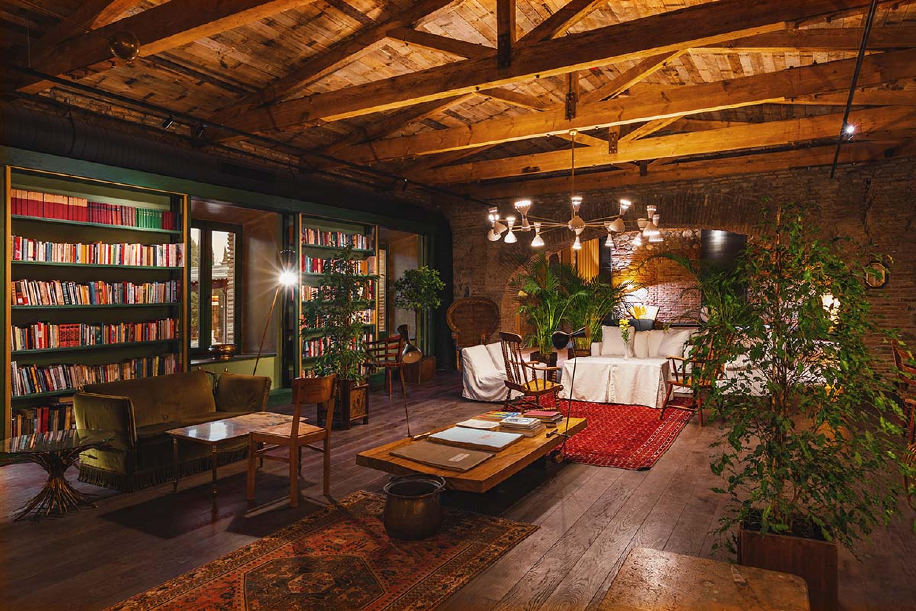 atmospheric library room with wooden floors and ceilings and Georgian rugs