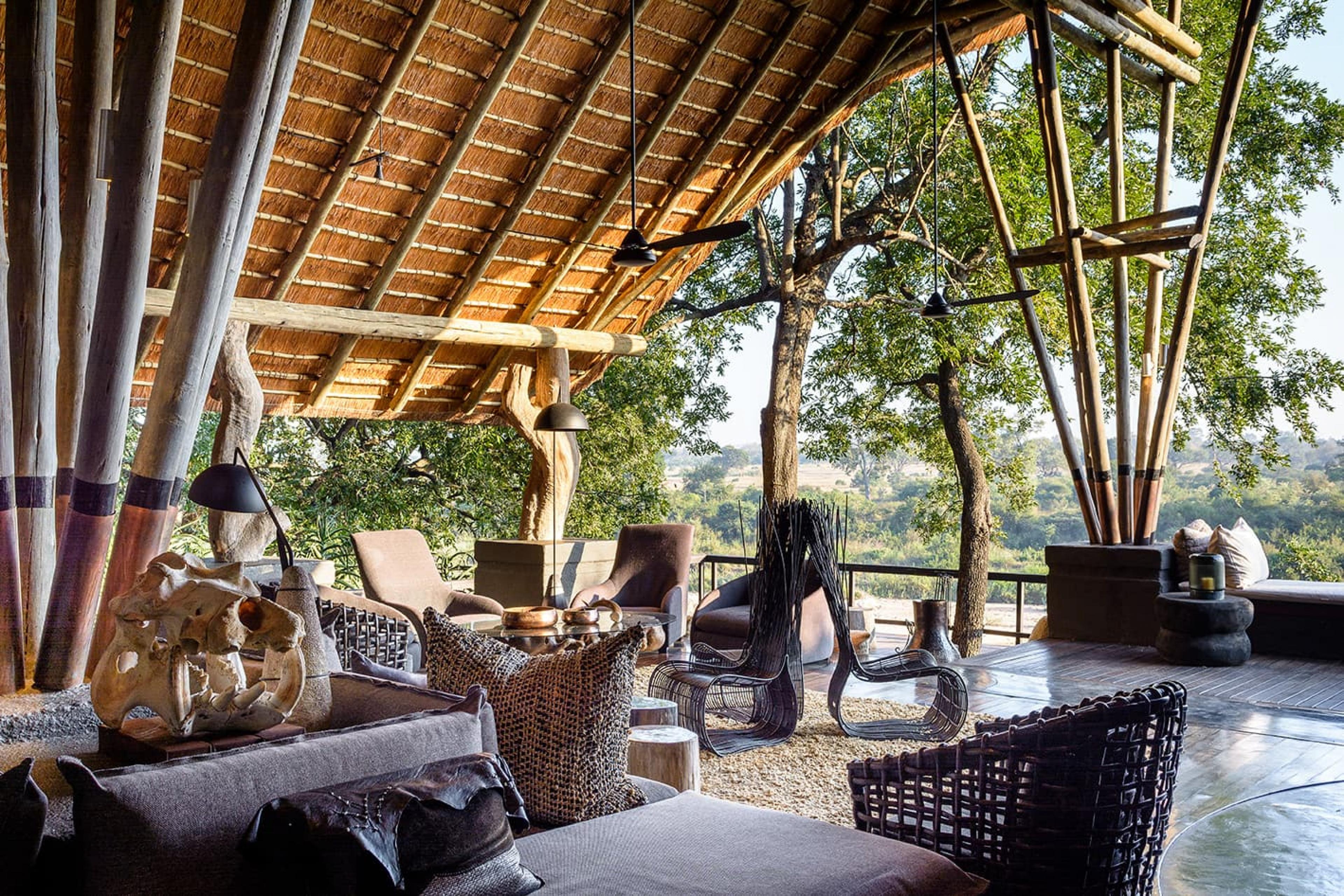 open-air sitting area with lounge chairs in African traditional style