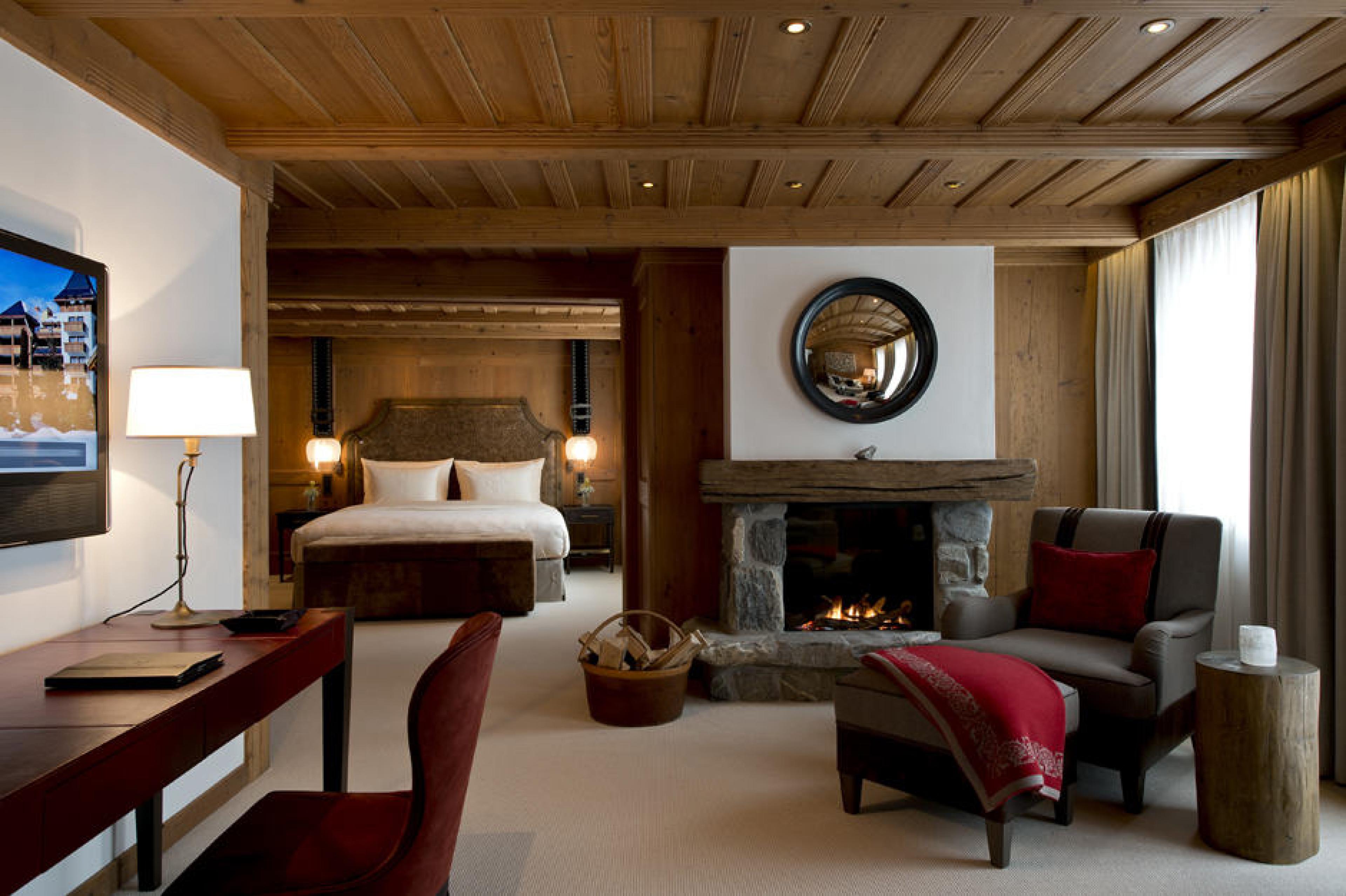 Junior Suite fireplace at Alpina Gstaad, Gstaad, Switzerland