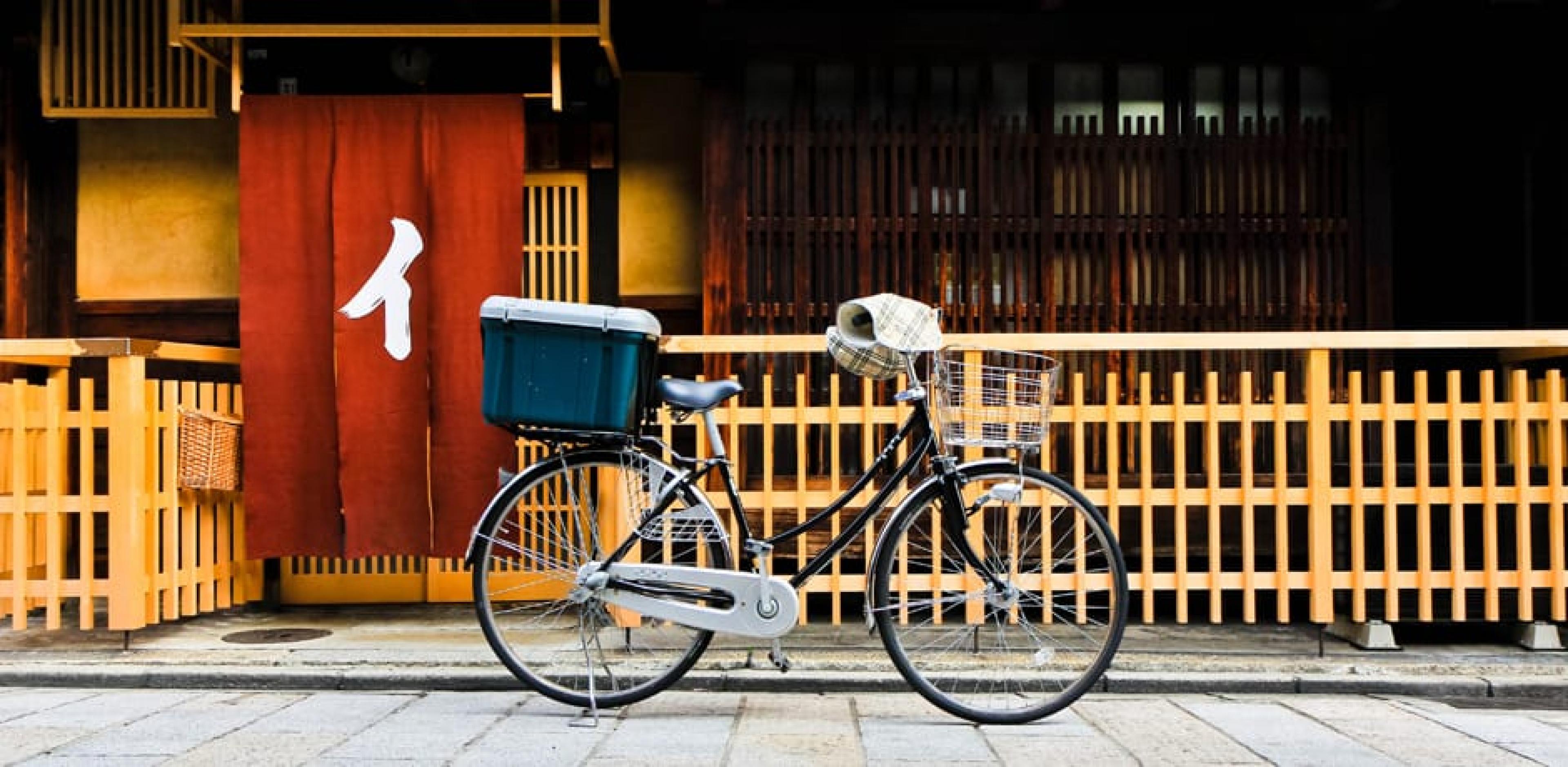 Bicycle parked on street in Kyoto Japan