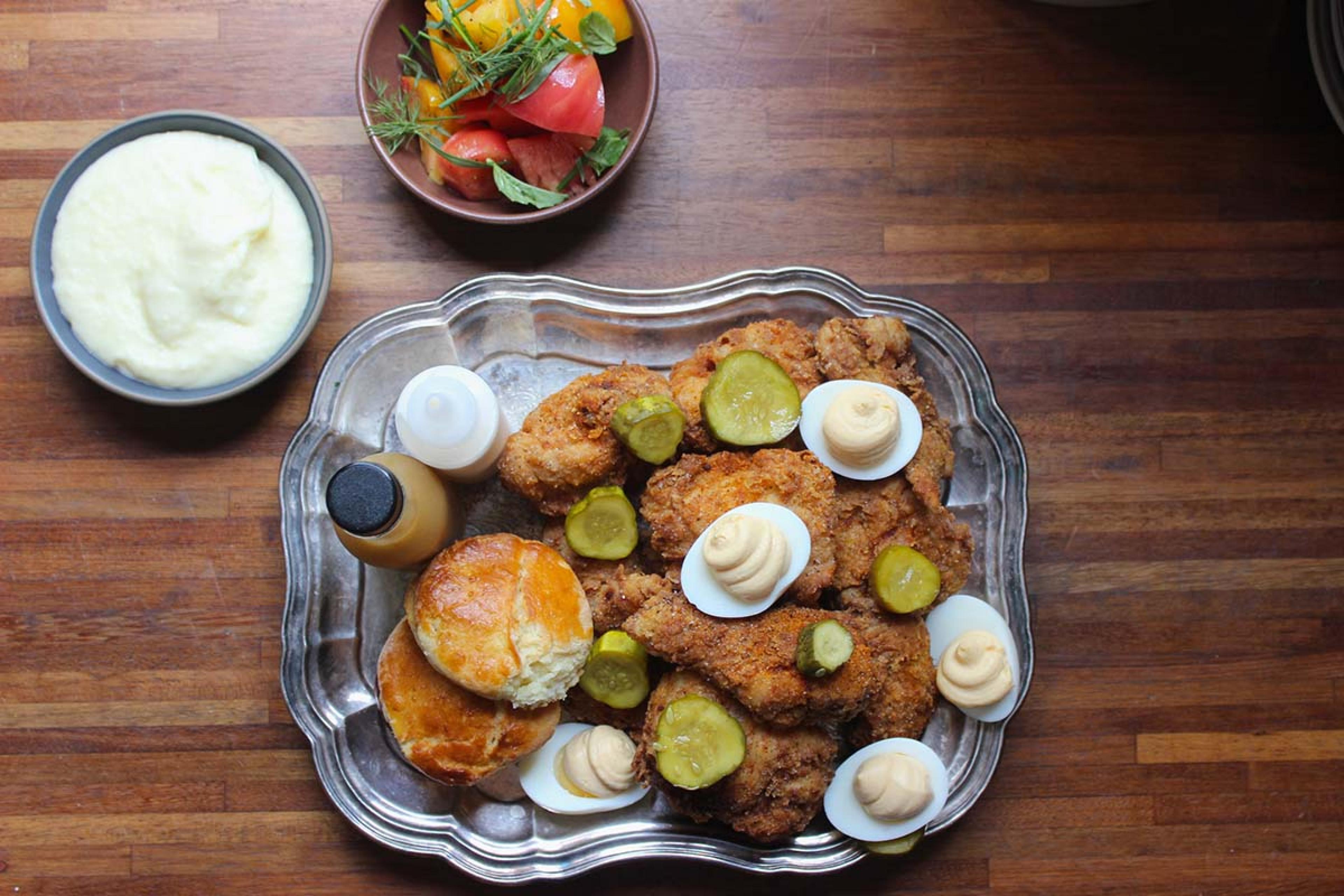 silver platter of fried chicken and deviled eggs