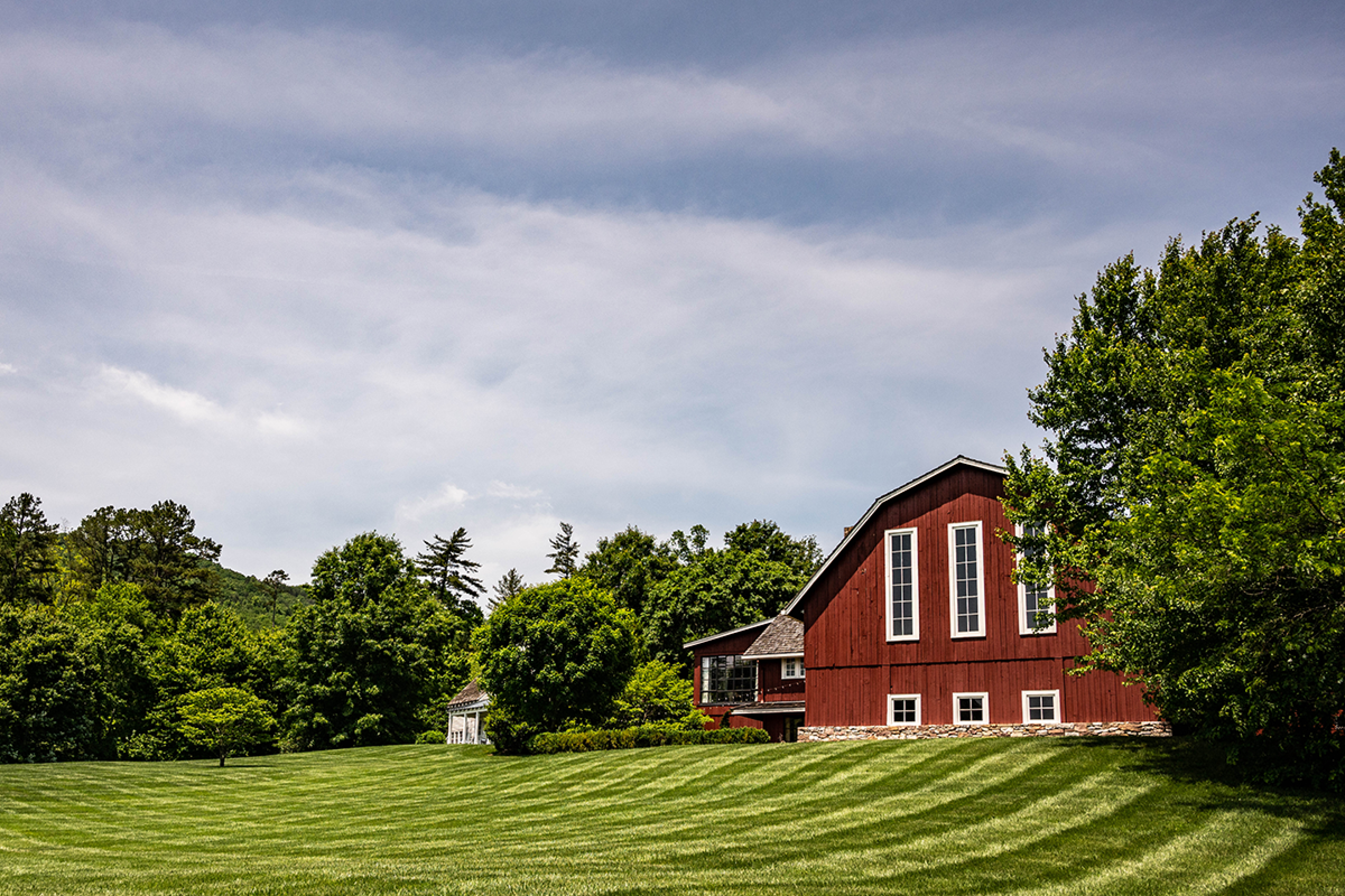 Red barn at the top of a hill