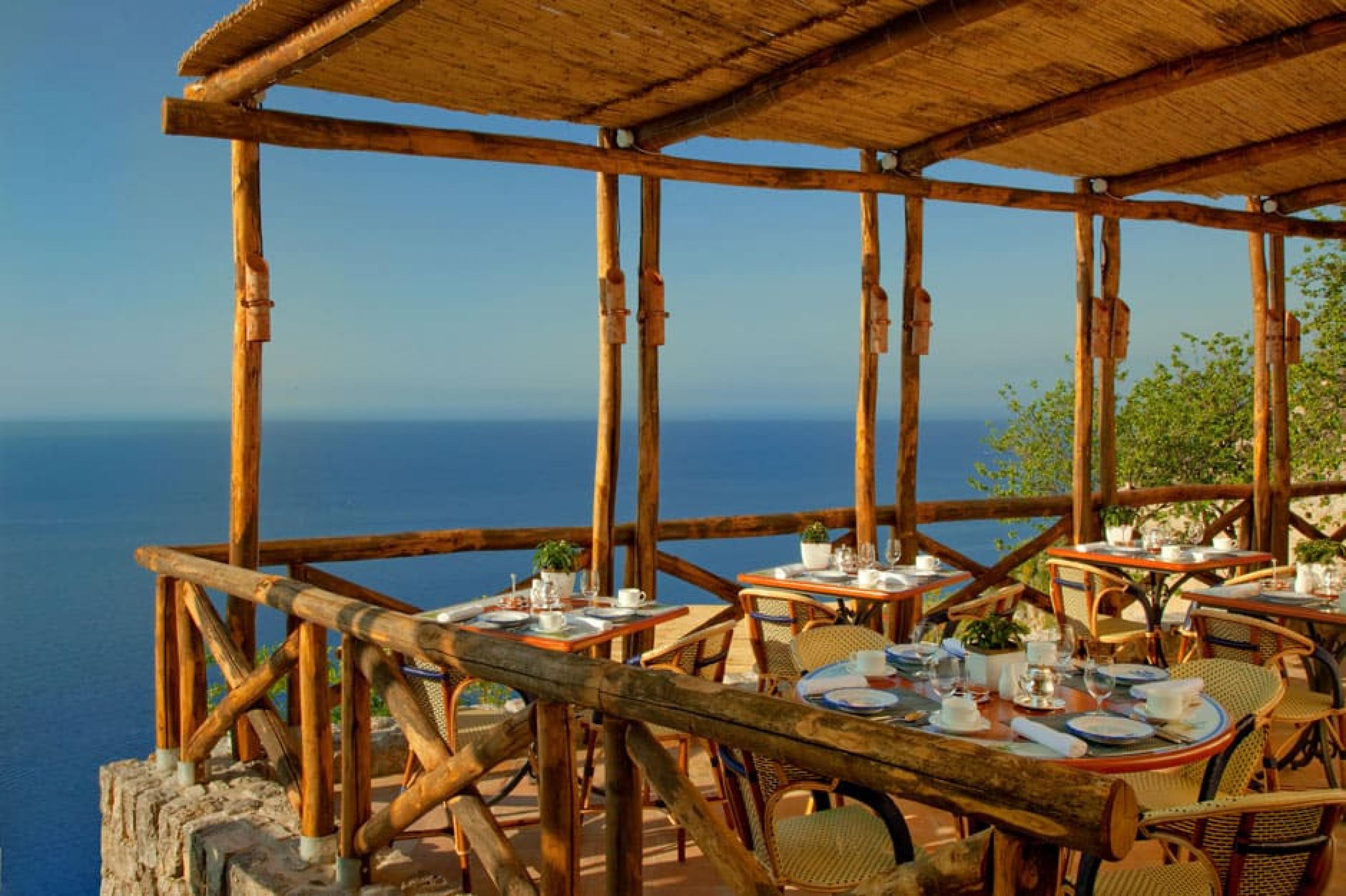 Outdoor dining at Il Refettorio at Monastero​ Santa Rosa​, Amalfi Coast, Italy