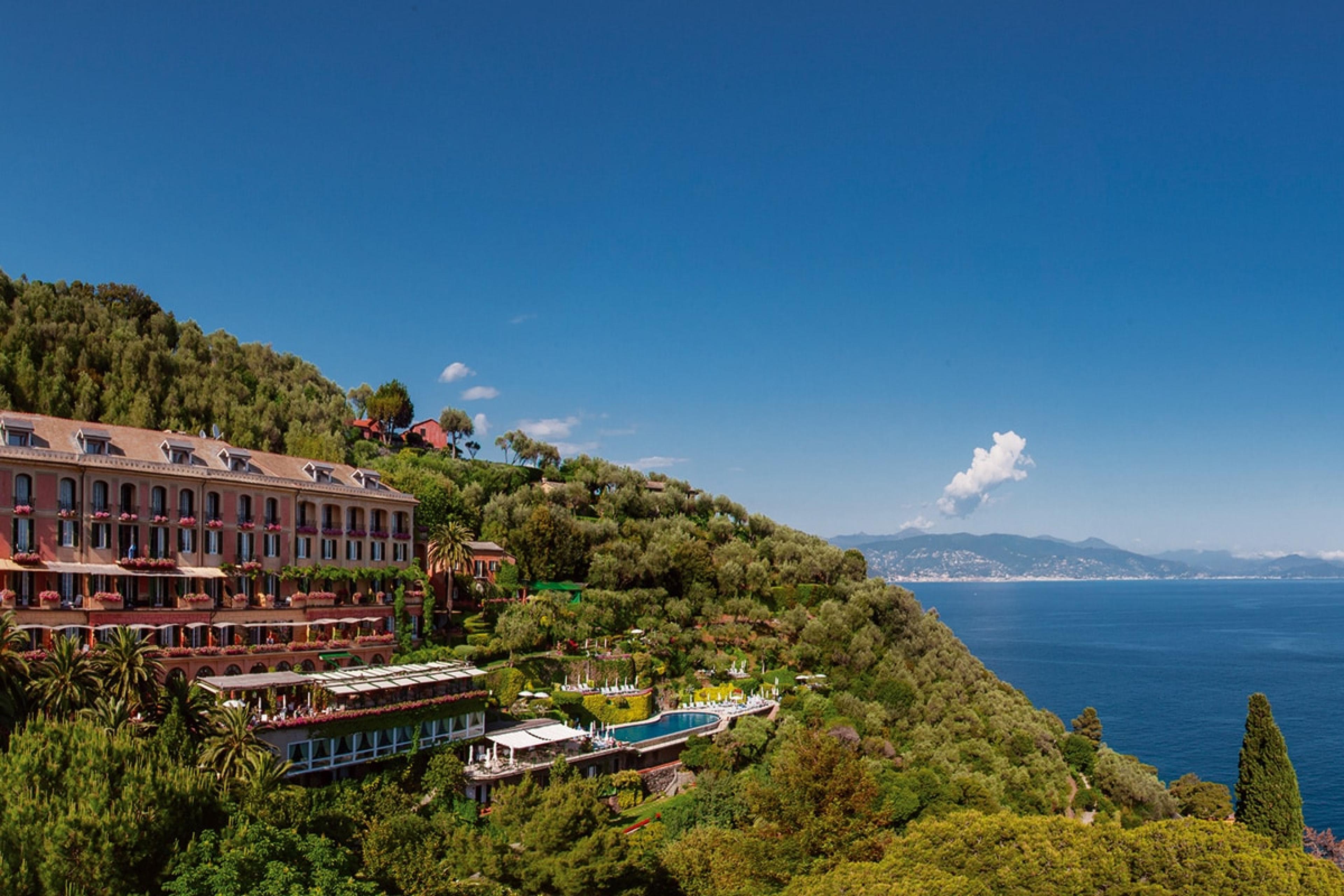 grand multi-story hotel on hill overlooking italian coast