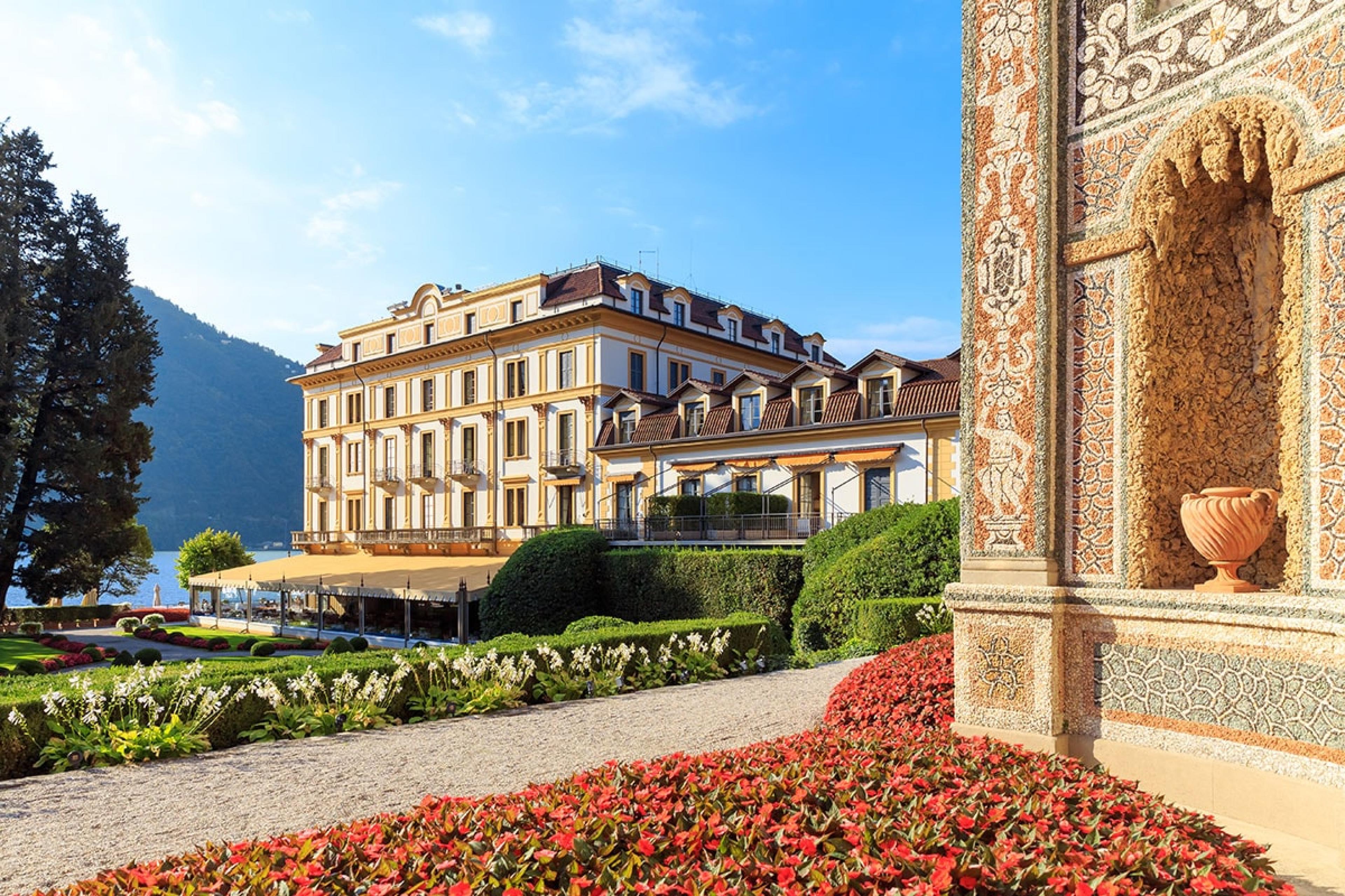 grand italian hotel on Lake Como with gold-painted trim on windows