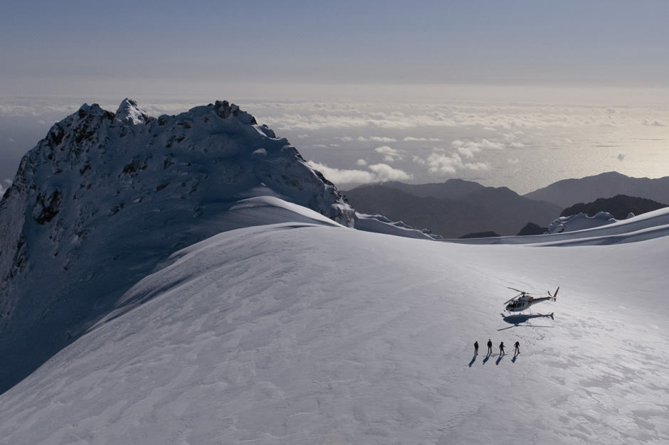 Helicopter with 4 heli-skiiers at Glacier Southern Lakes in New Zealand