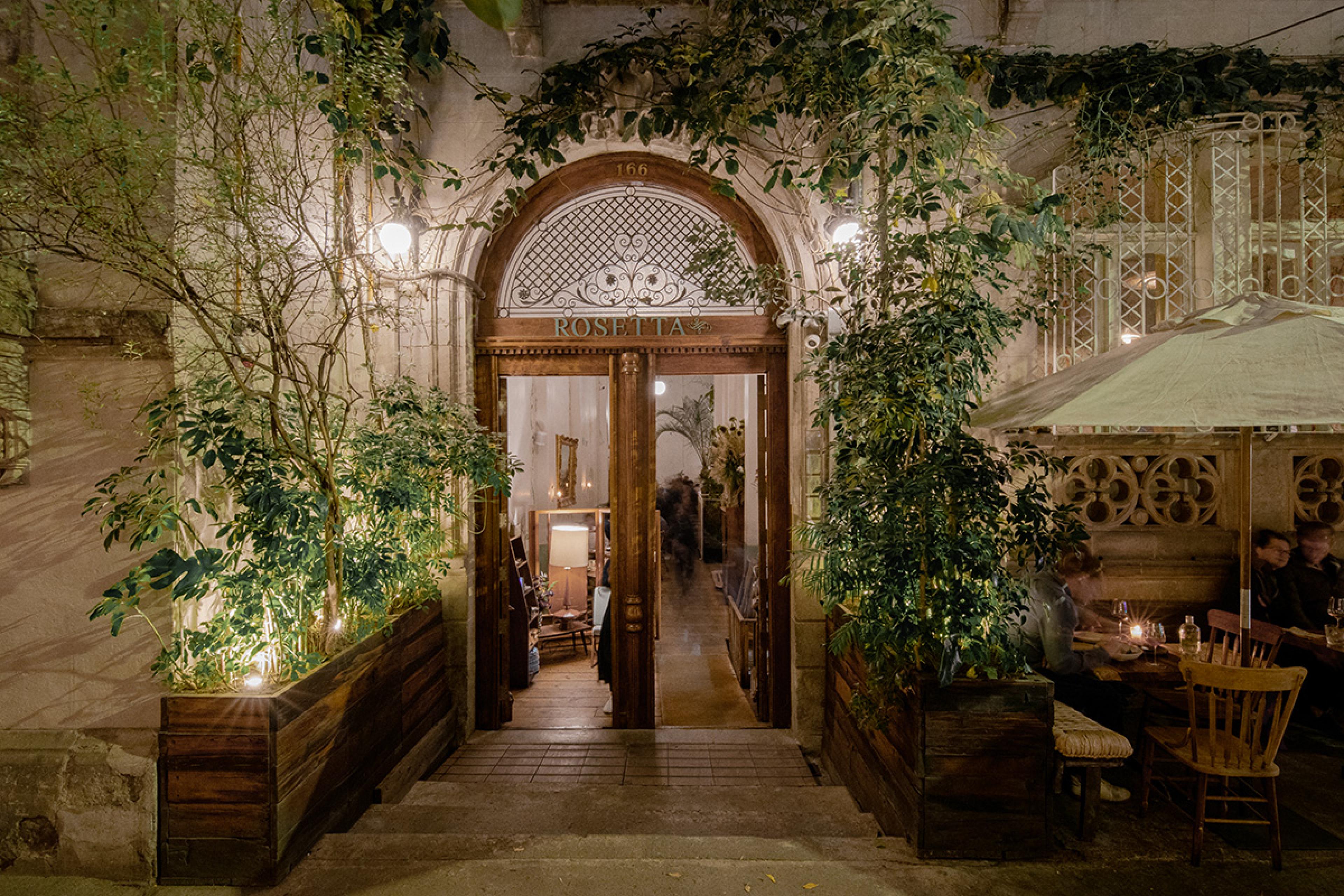 whimsical restaurant entrance surrounded by vines