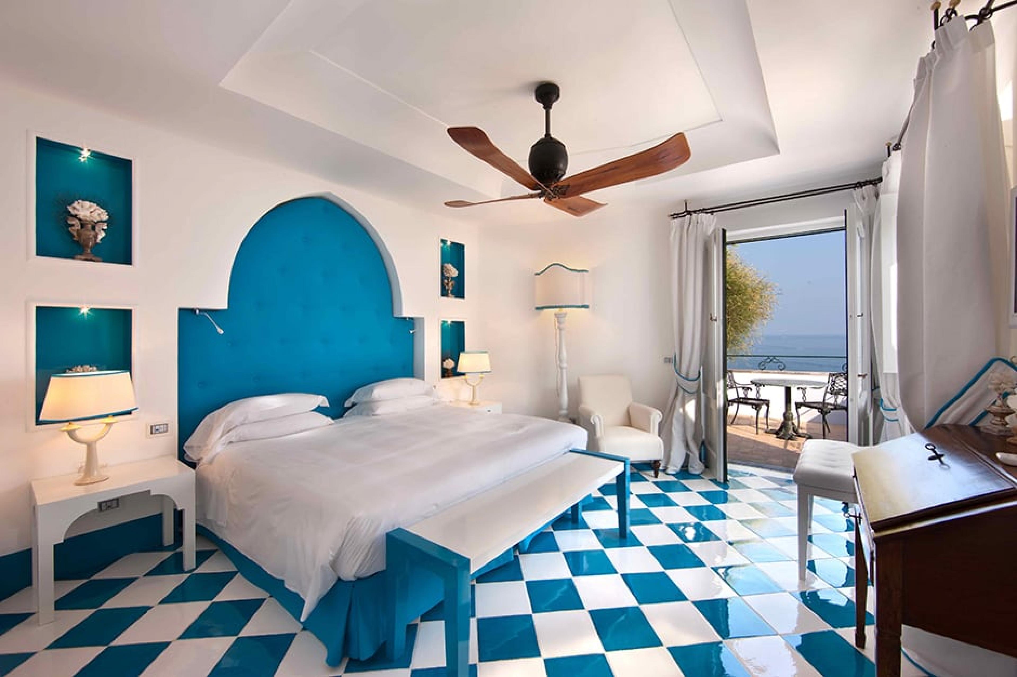Bedroom with blue checked floor at  Villa TreVille, Amalfi Coast, Italy