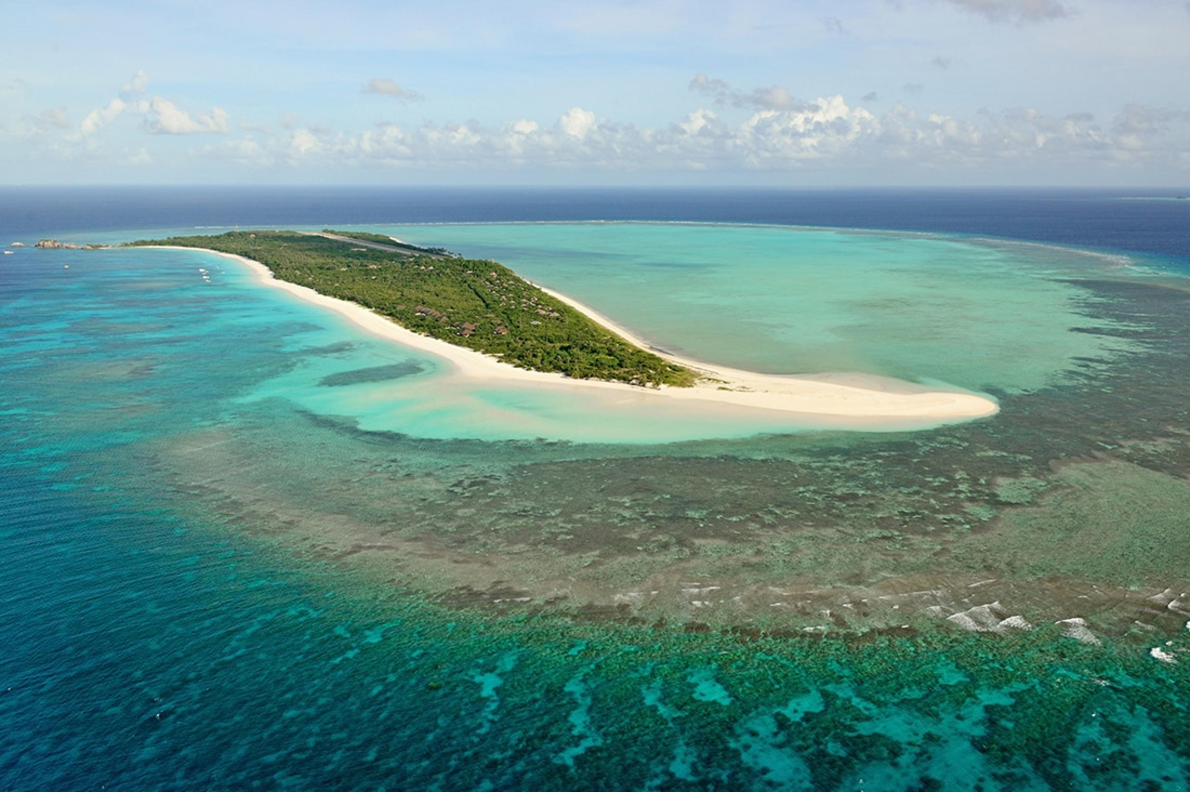 aerial view of private tropical island with beach