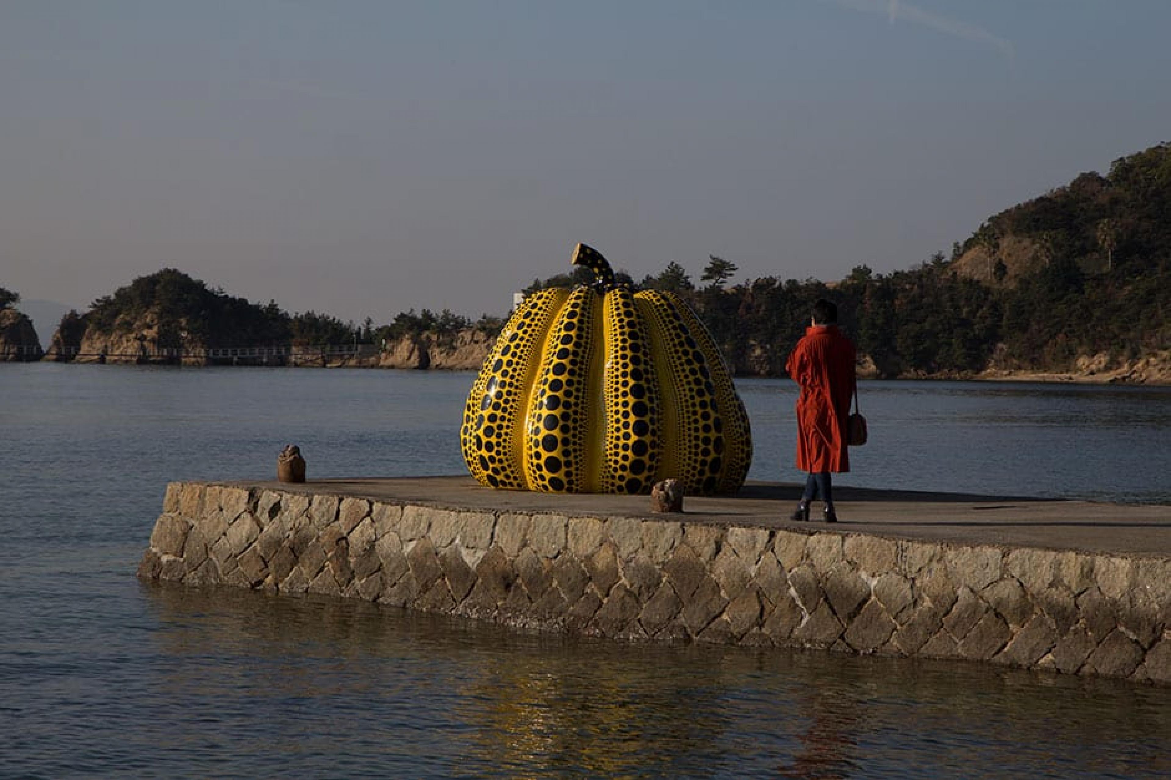 Large yellow sculpture near Benesse House on Naoshima Island in Japan
