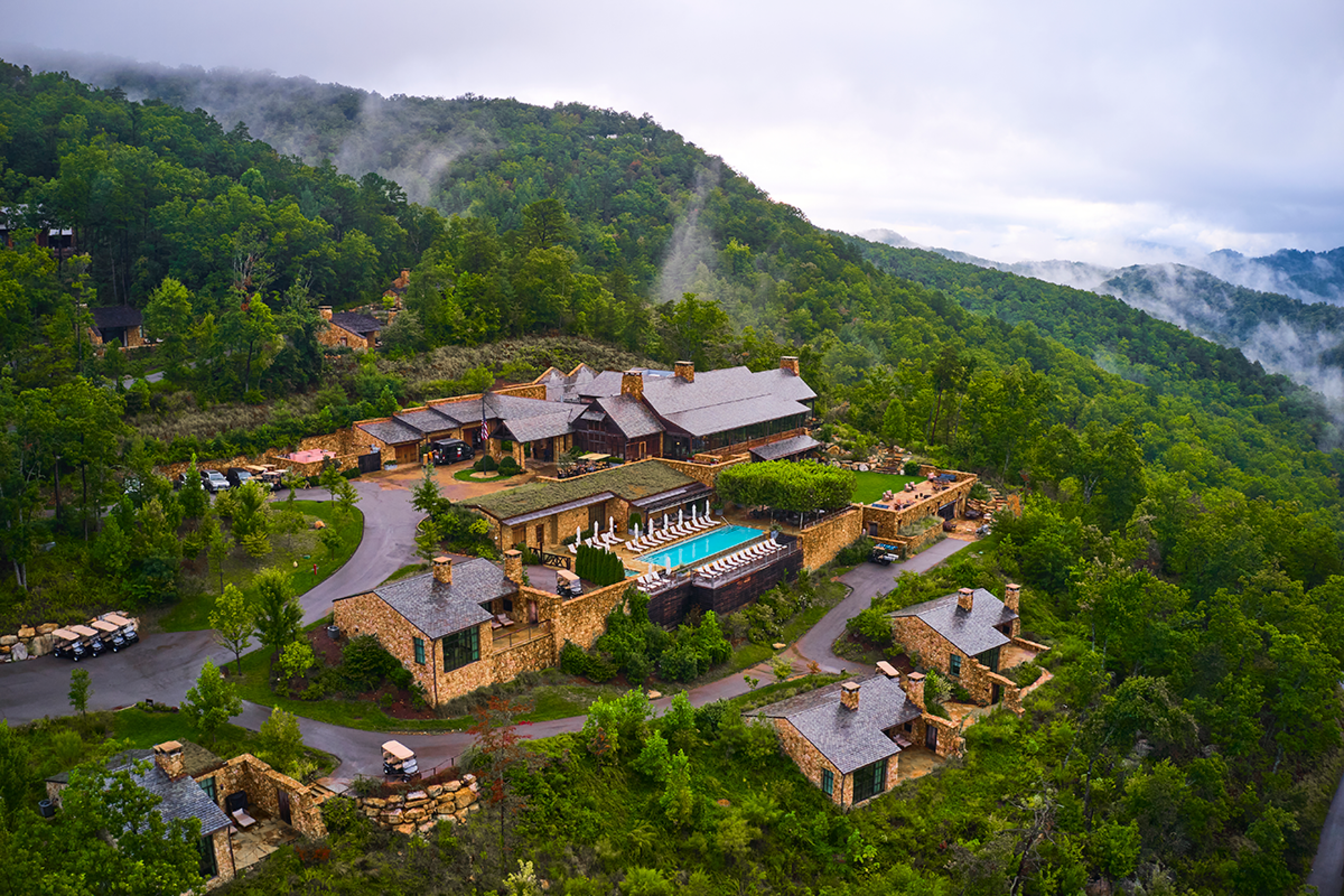 Blackberry Mountain from an arial view. With entire property and pool. Fog on the mountains.