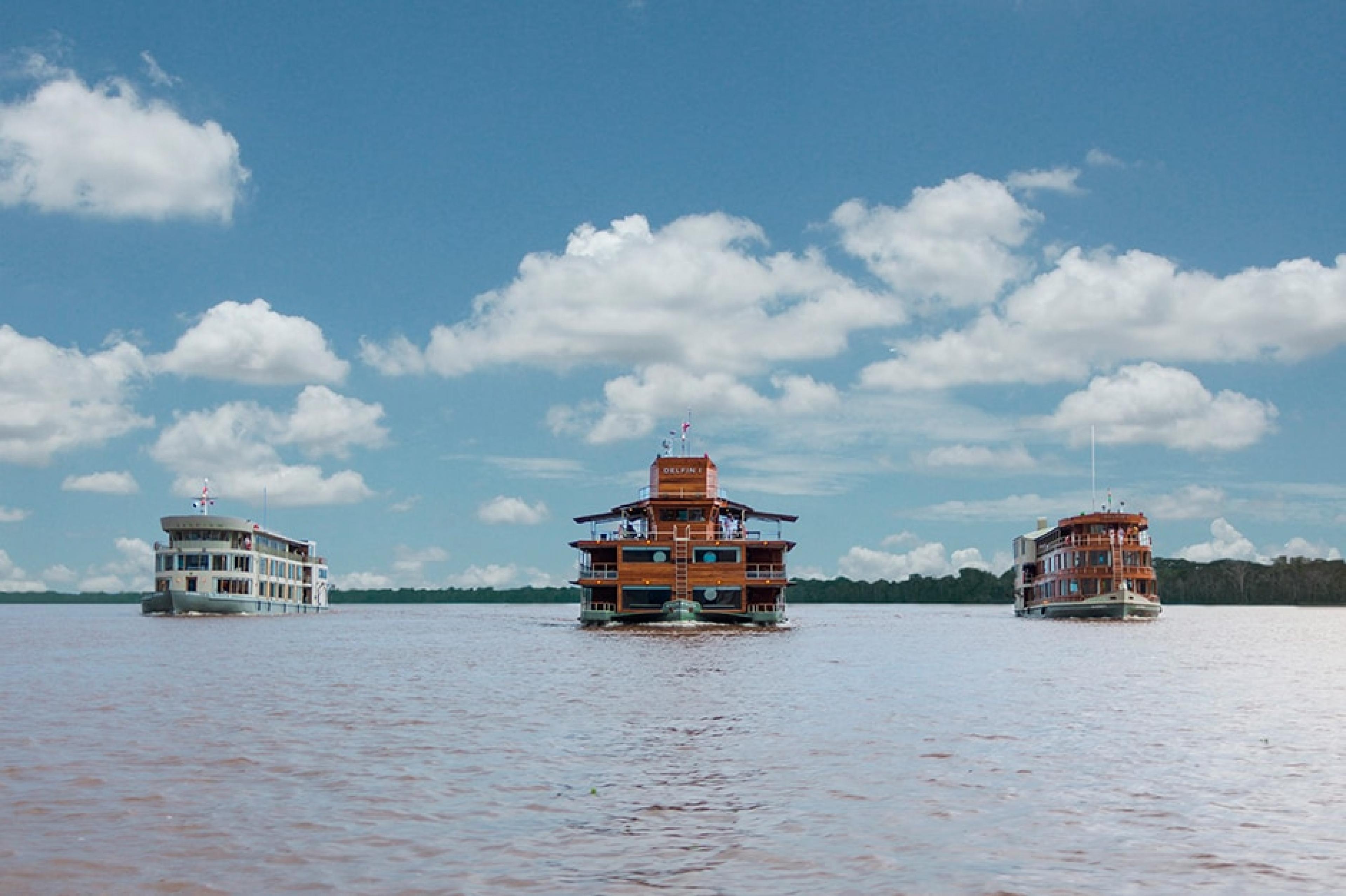 three river cruise vessels in the amazon 