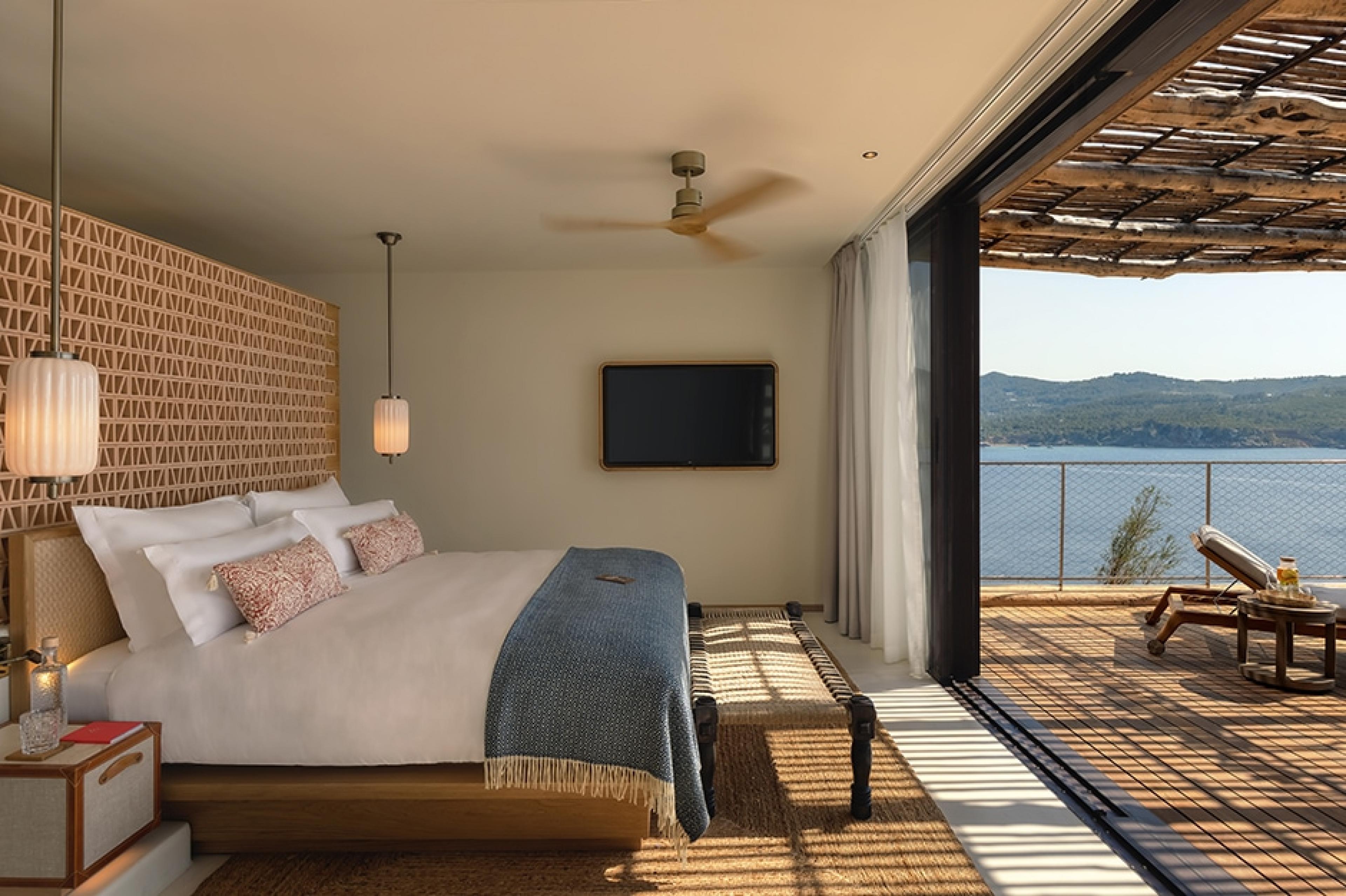 hotel bedroom with terrace and ocean view