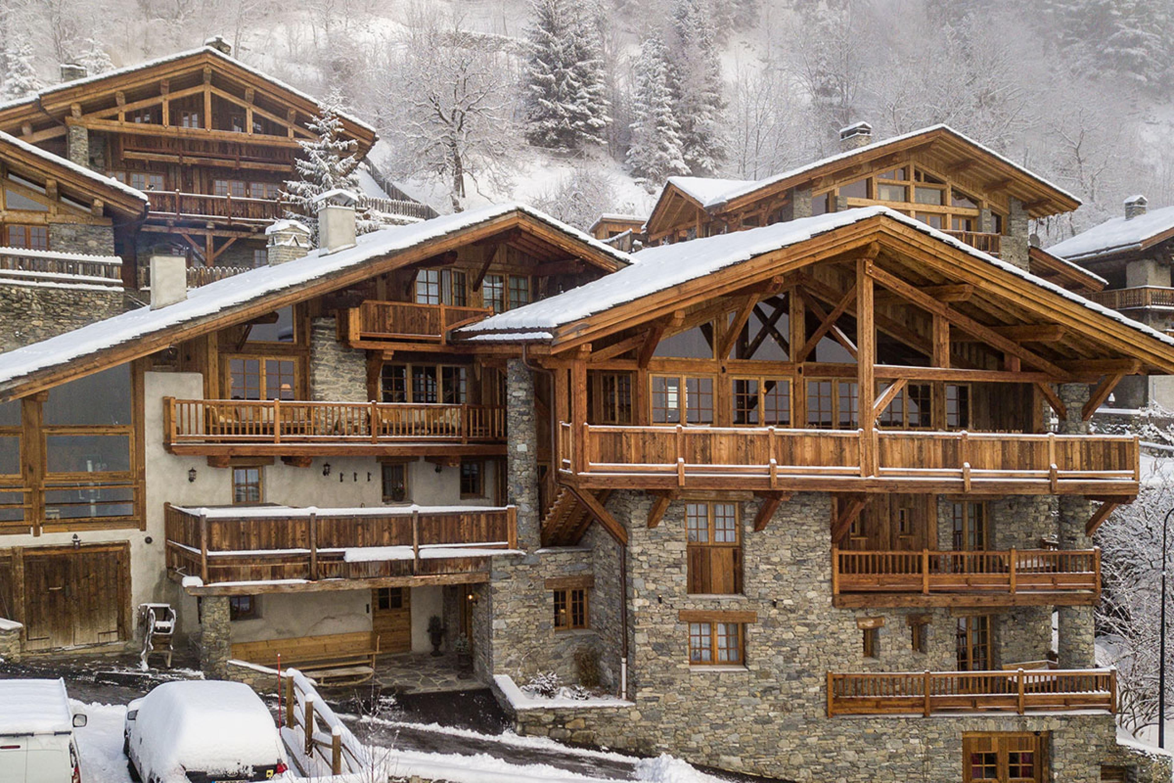 view of traditional designed french chalets in winter