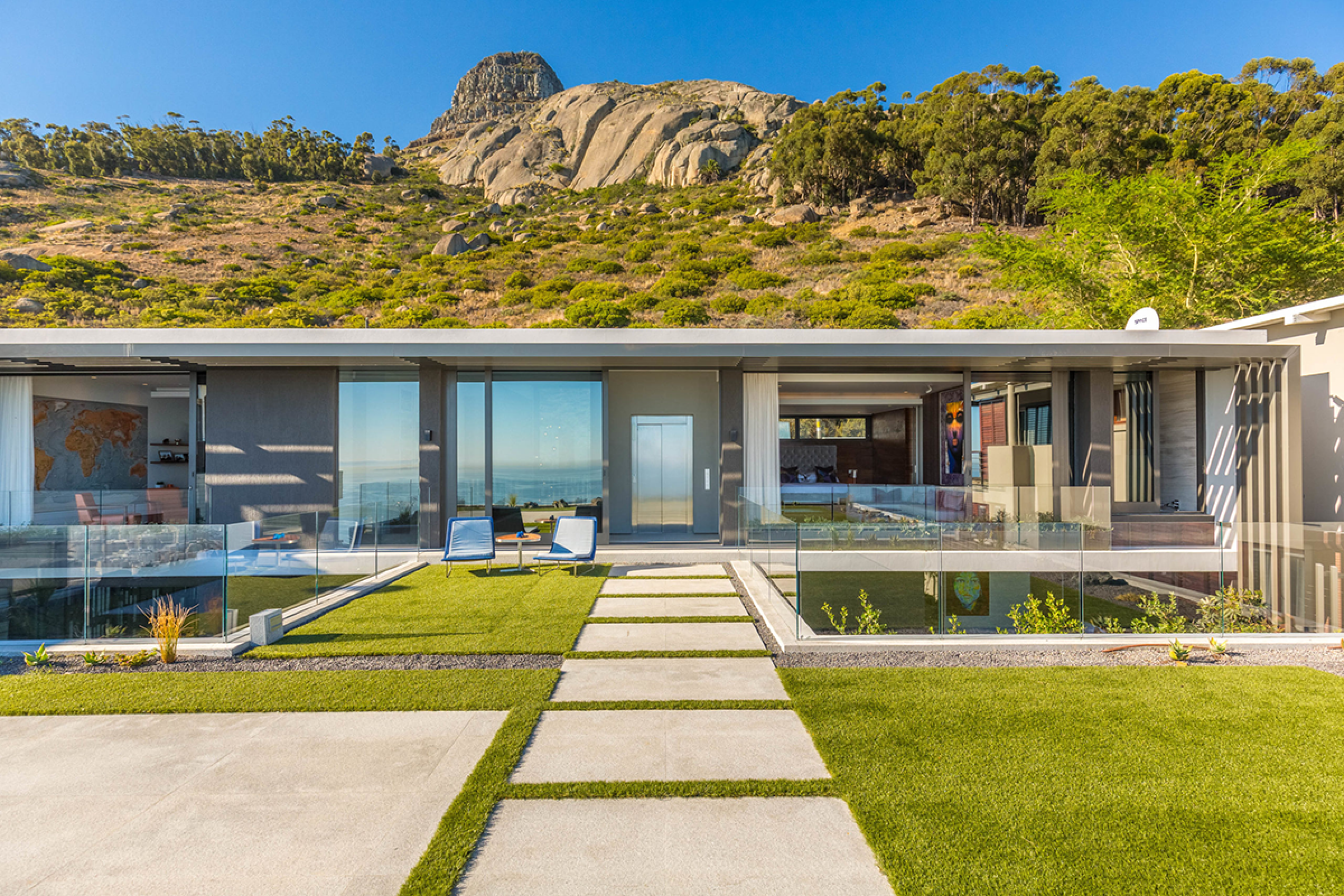 villa with a stone pathway set into a hillside