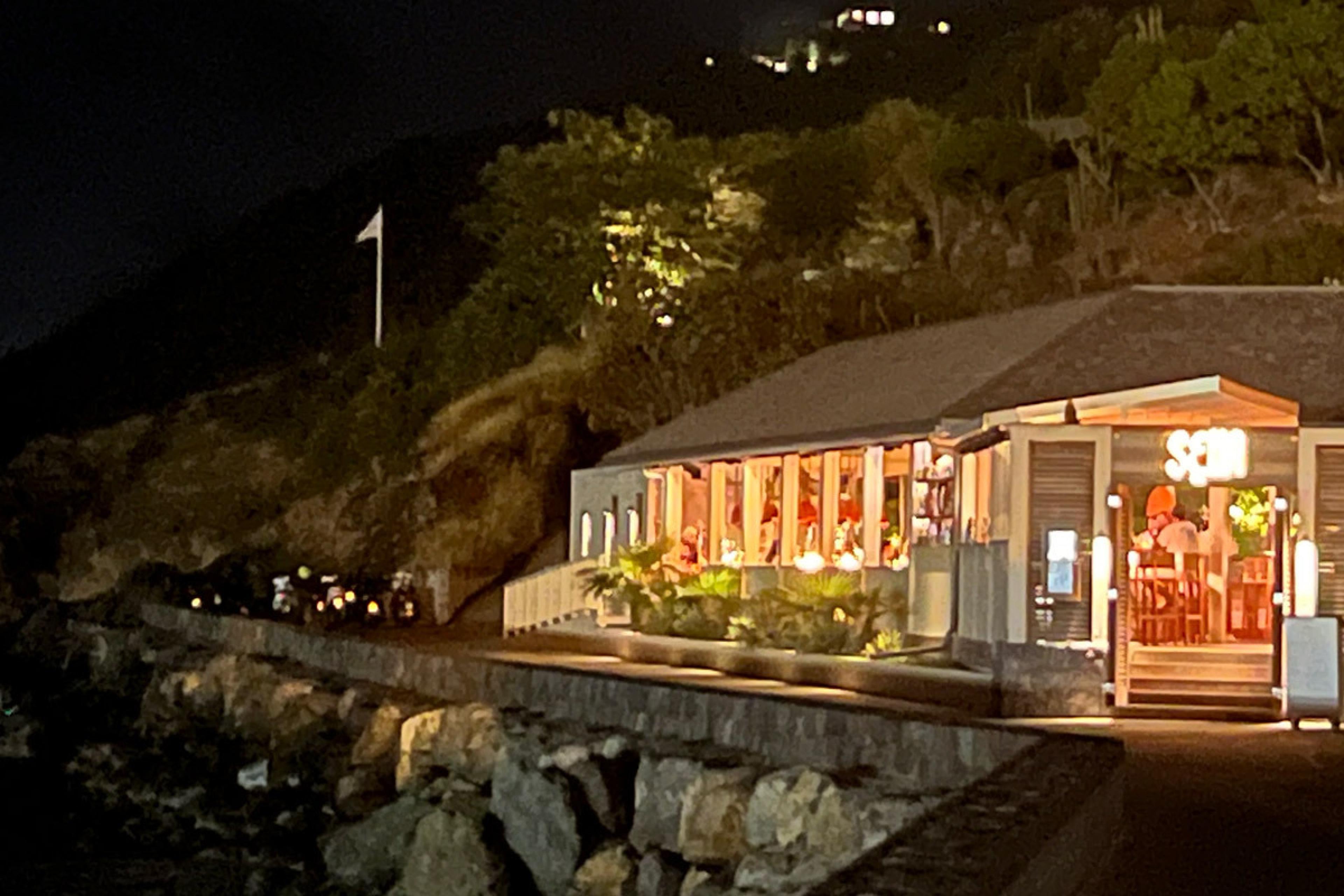 night shot of a waterfront restaurant in St. Barth's
