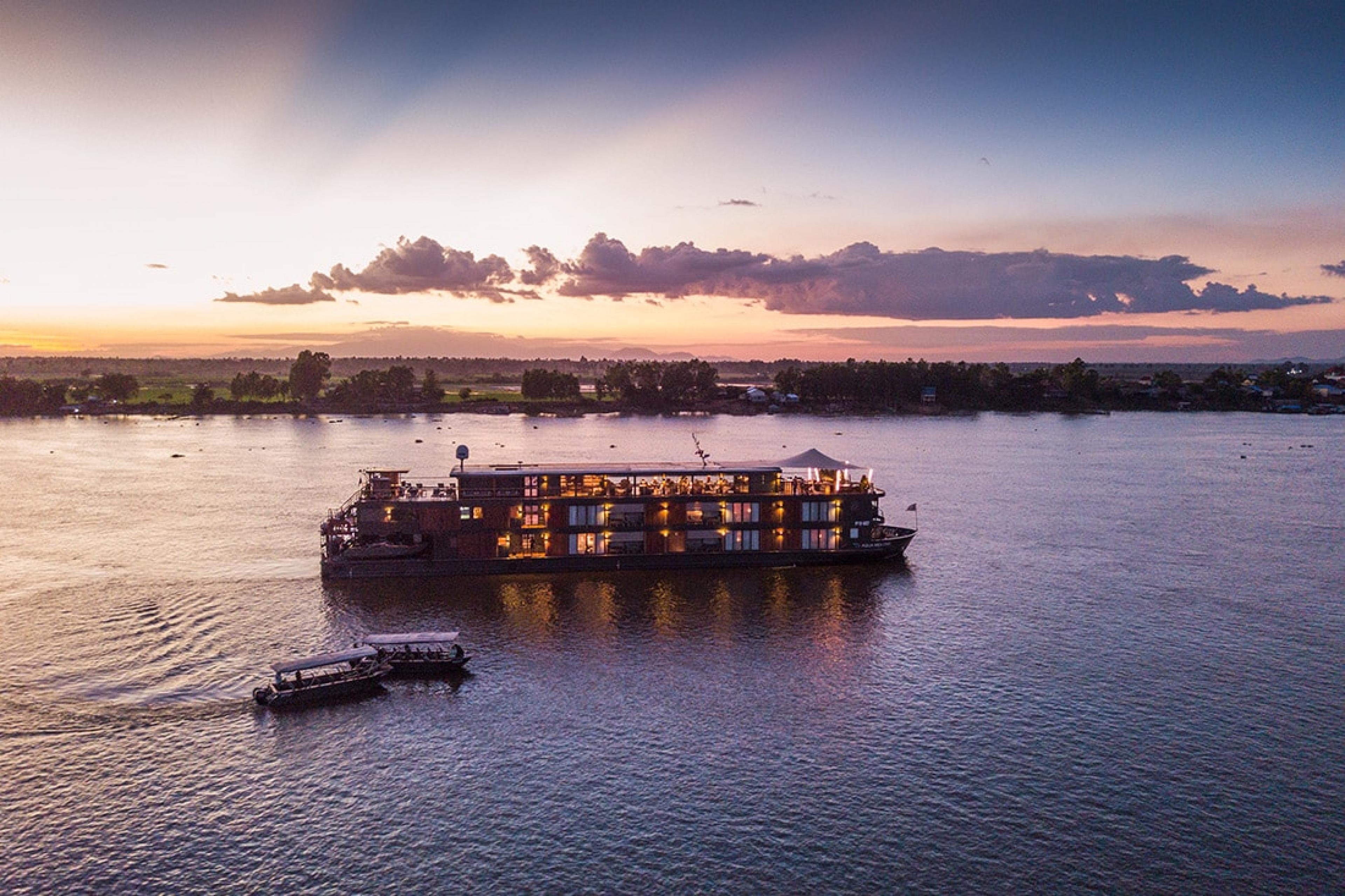 river cruise ship with three levels on Mekong River