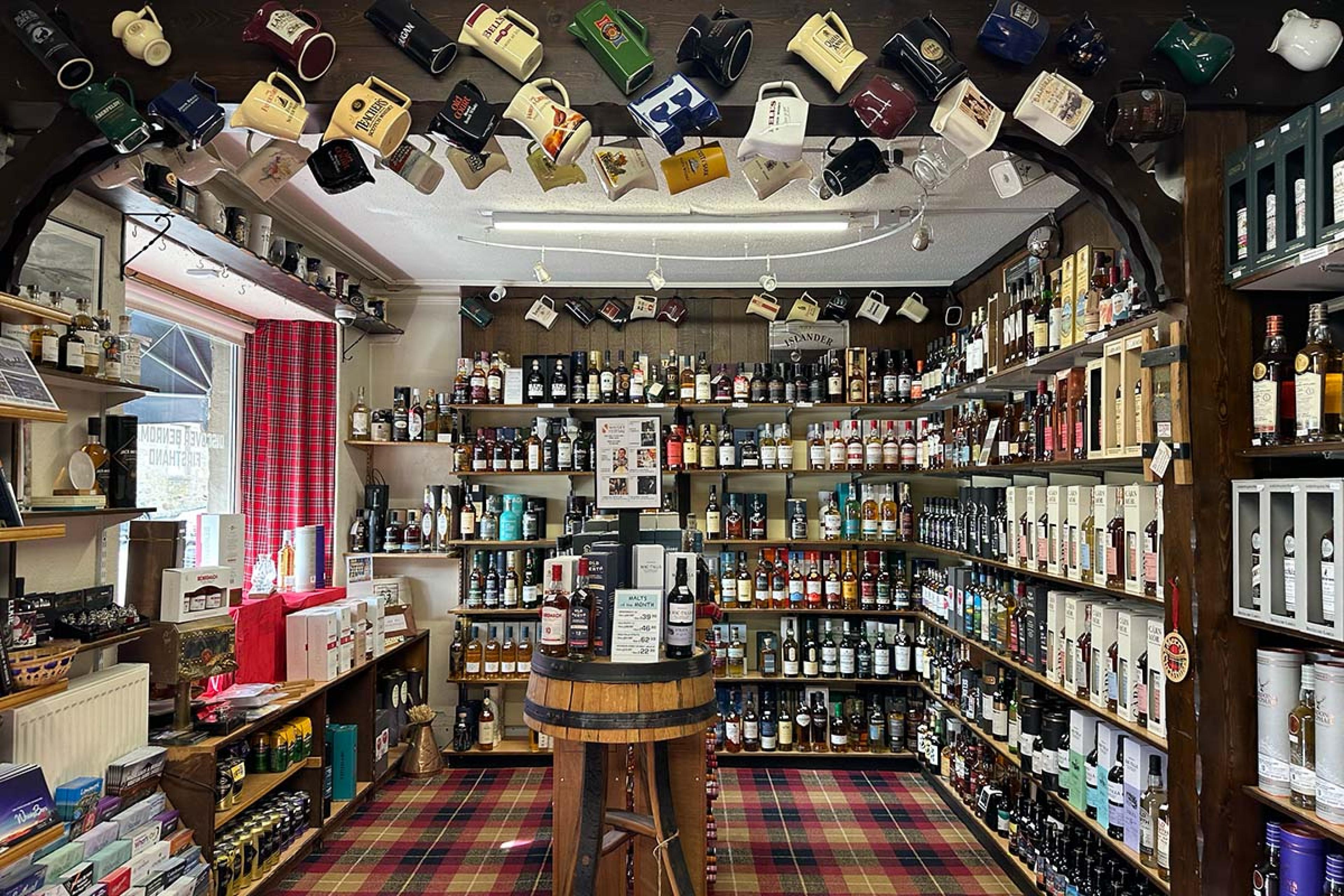 store interior with whisky bottles all over the walls and ceiling