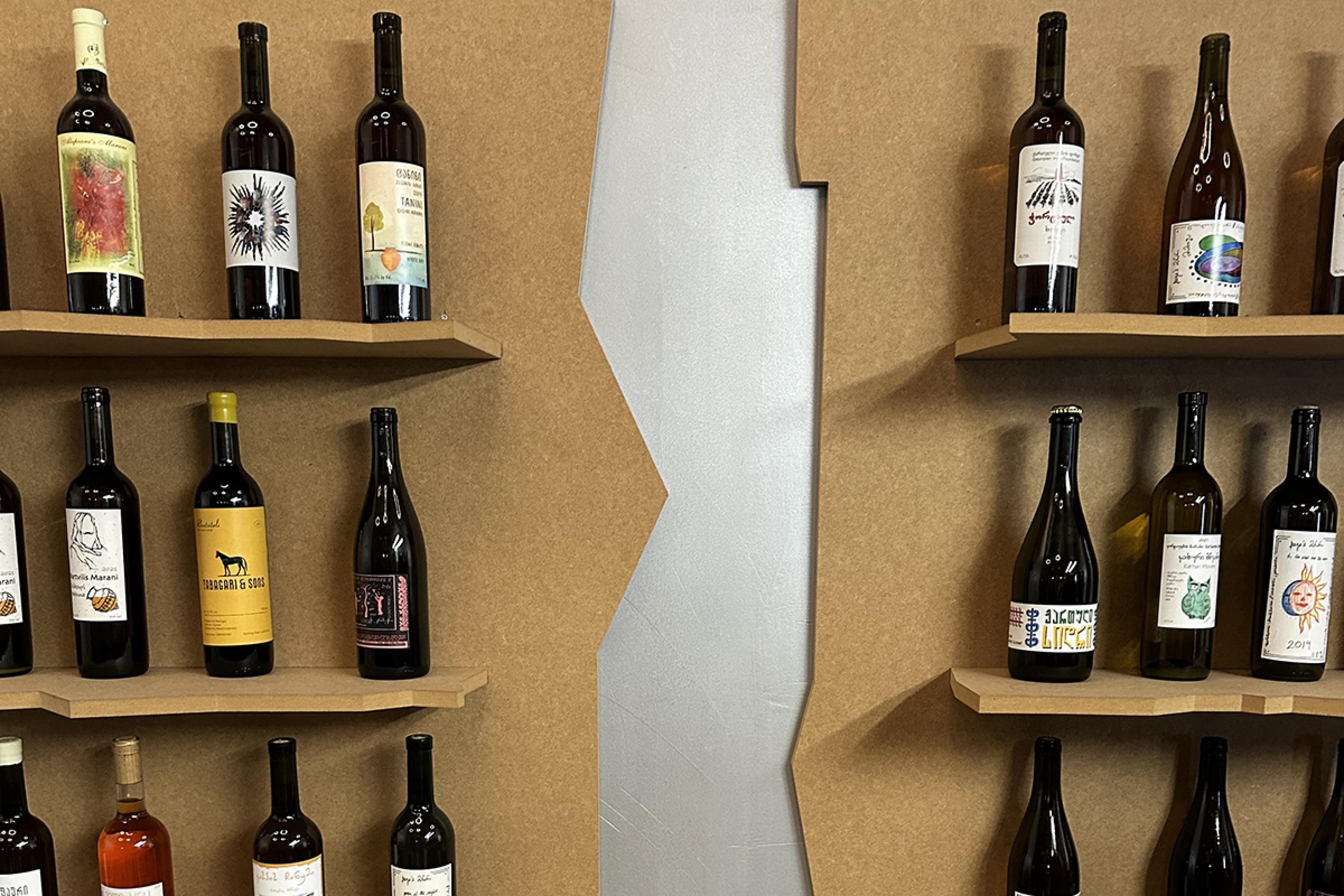 wooden shelves with wine bottles displayed