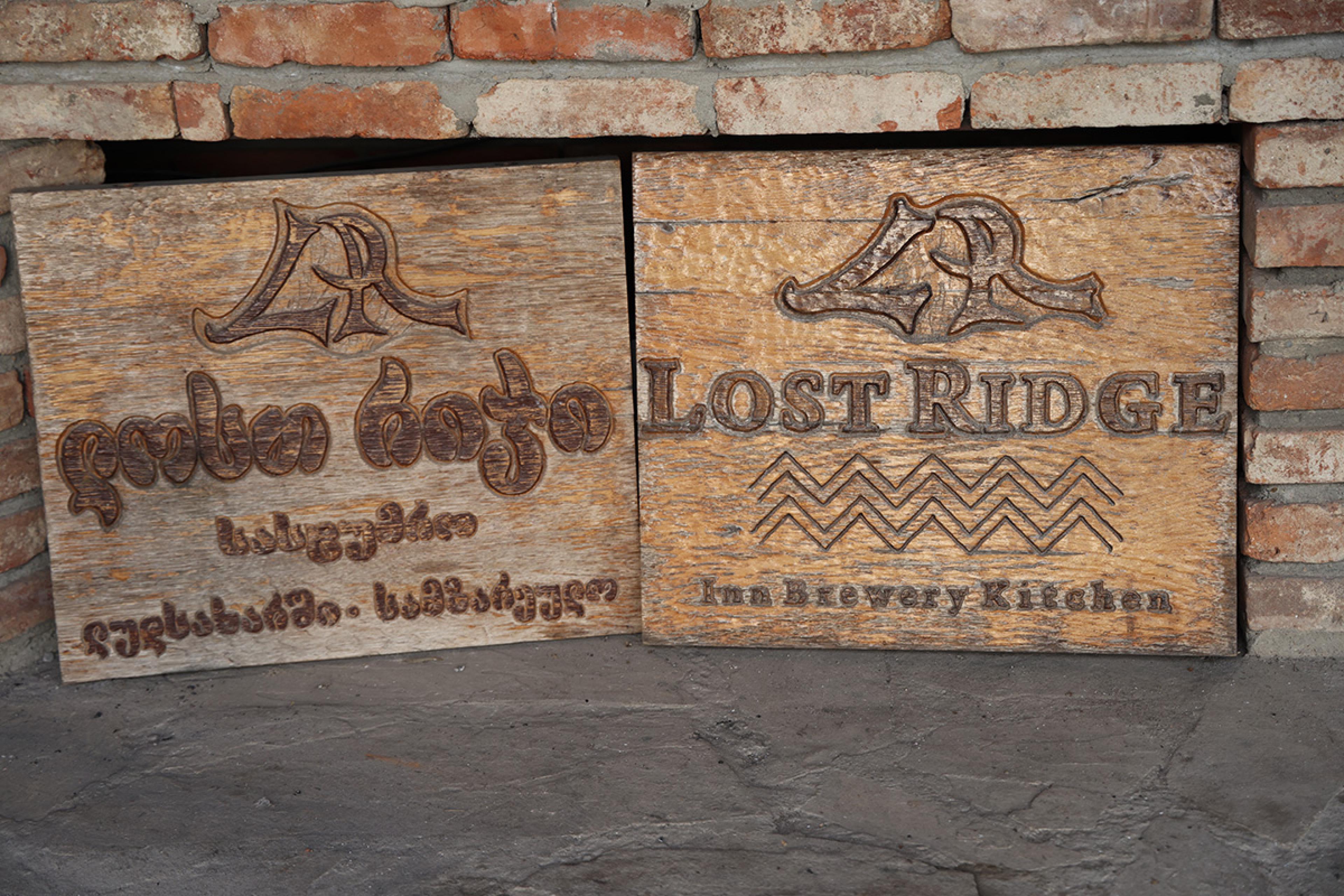 carved wooden signs