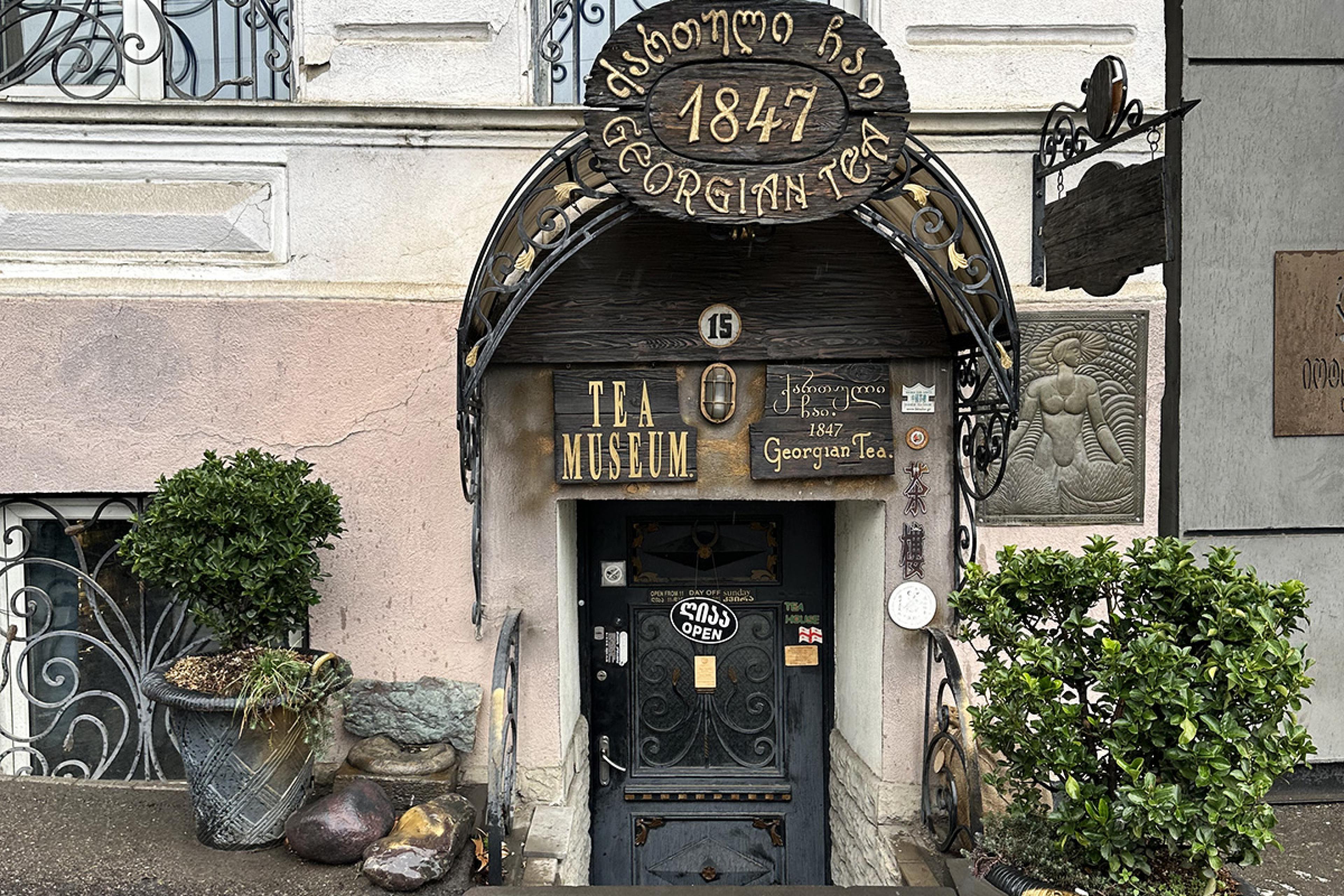 shop exterior with a charming wooden sign