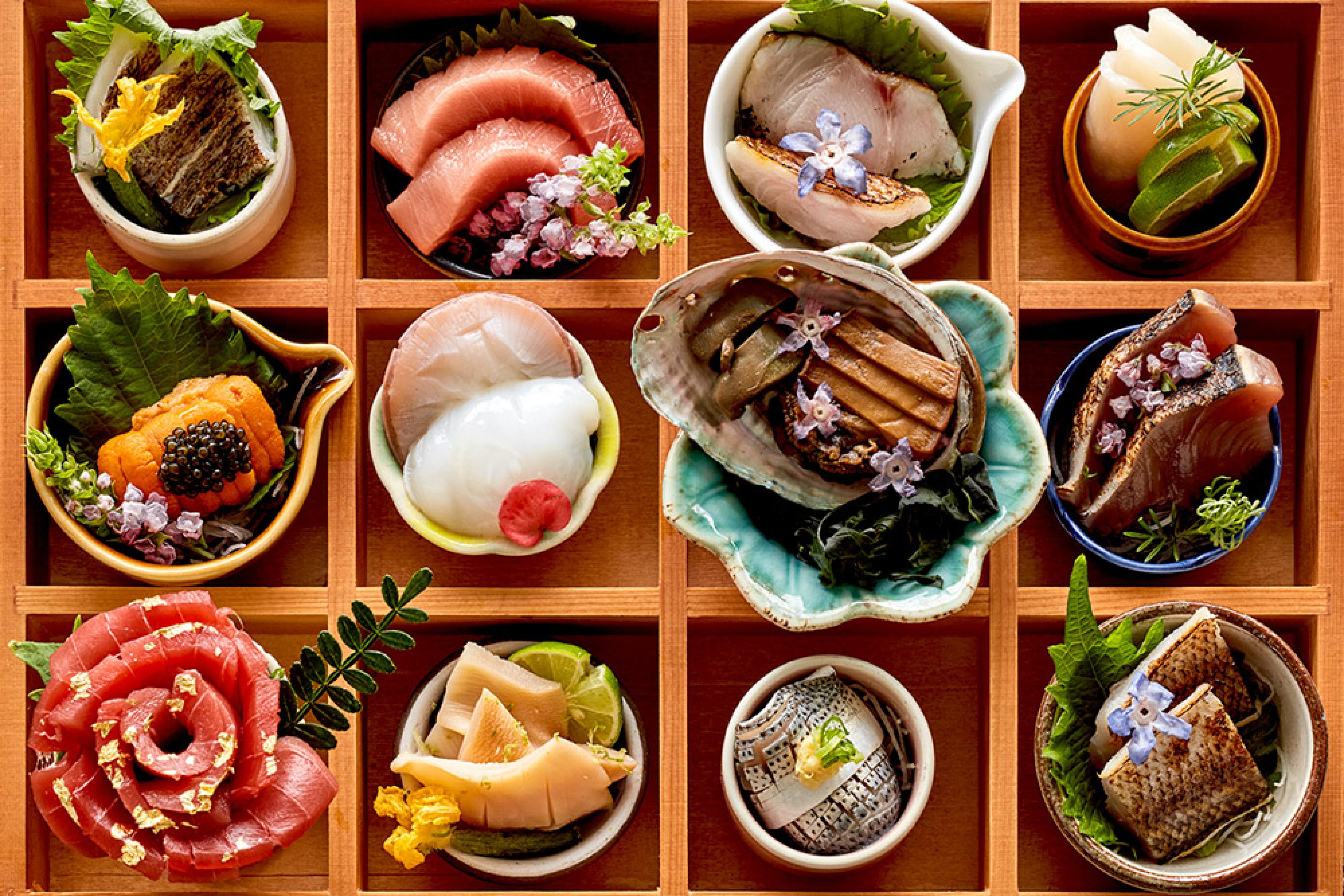 overhead view of sashimi amakase tray with multiple raw fish options