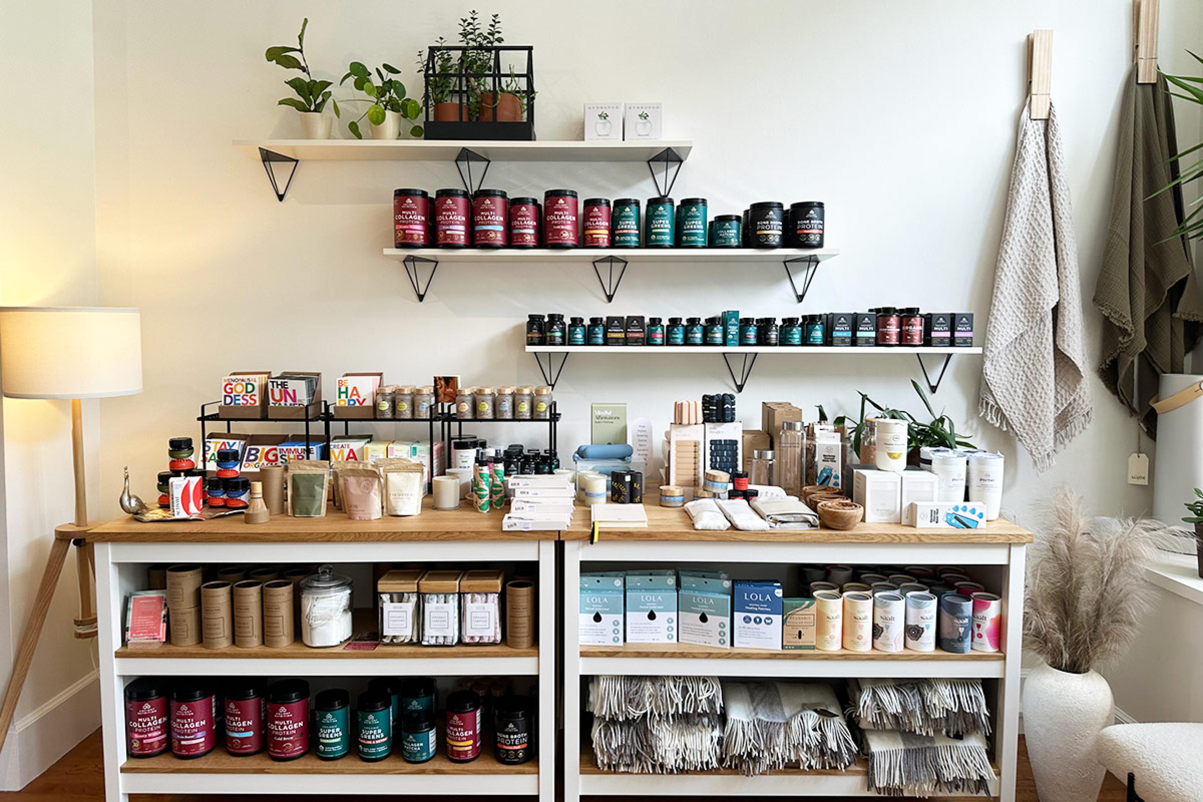 gift store with products like candles on a bookshelf