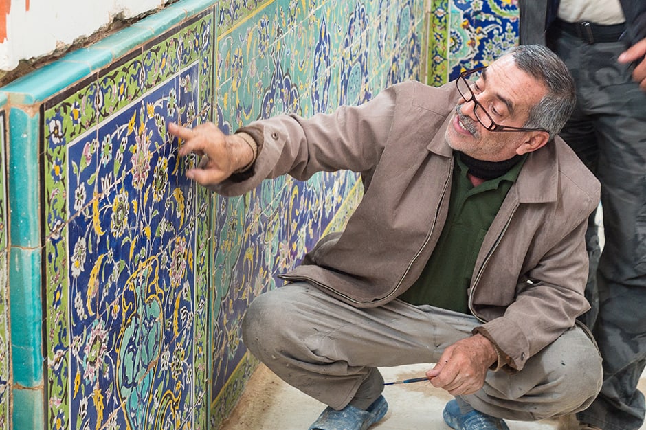 Man teaching about blue tiles in Iran