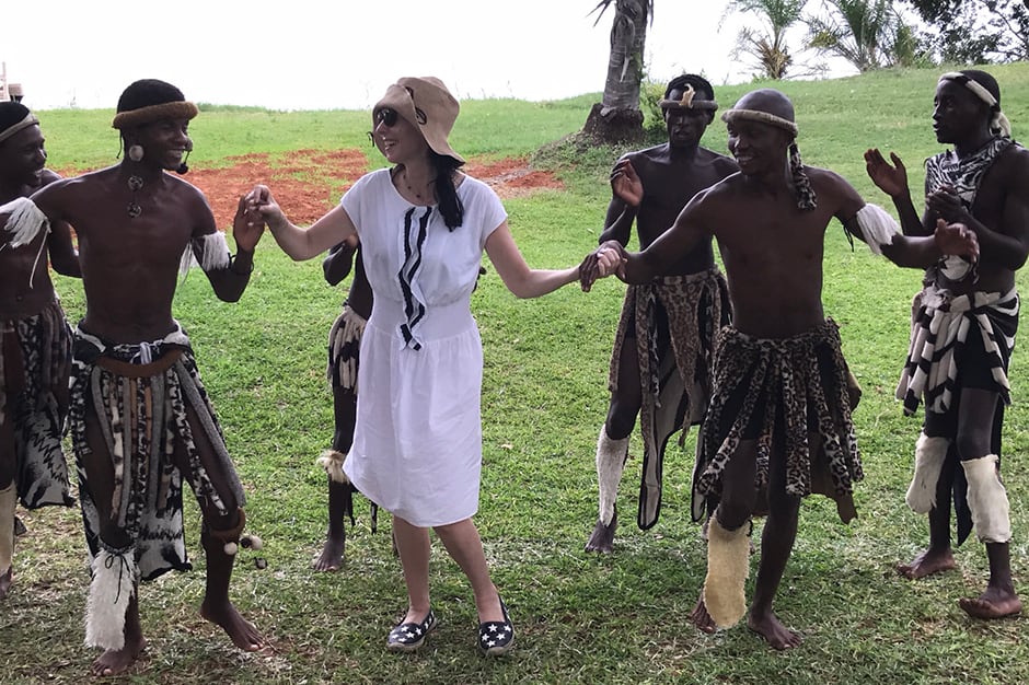  Jill Kargman dancing with local men on safari in Africa