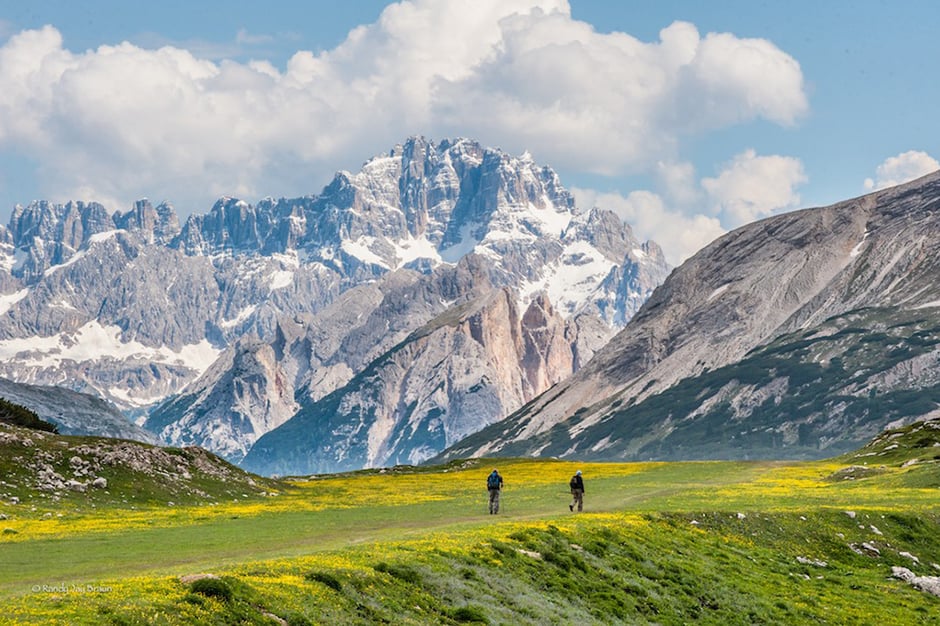 Two hikers in Dolomites in Italy