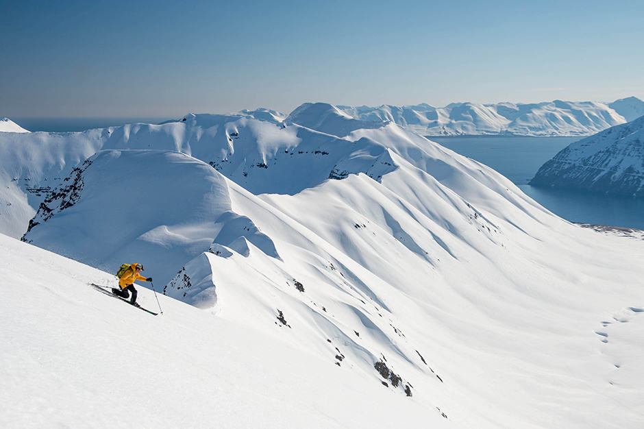 Downhill snow skiier on an empty mountain in Iceland