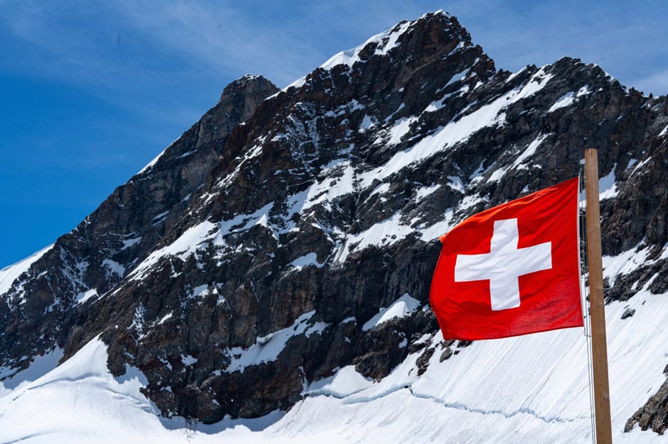 Waving Swiss flag, taken at the Jungfraujoch at 11,000 feet, Courtesy Ian Tibbals