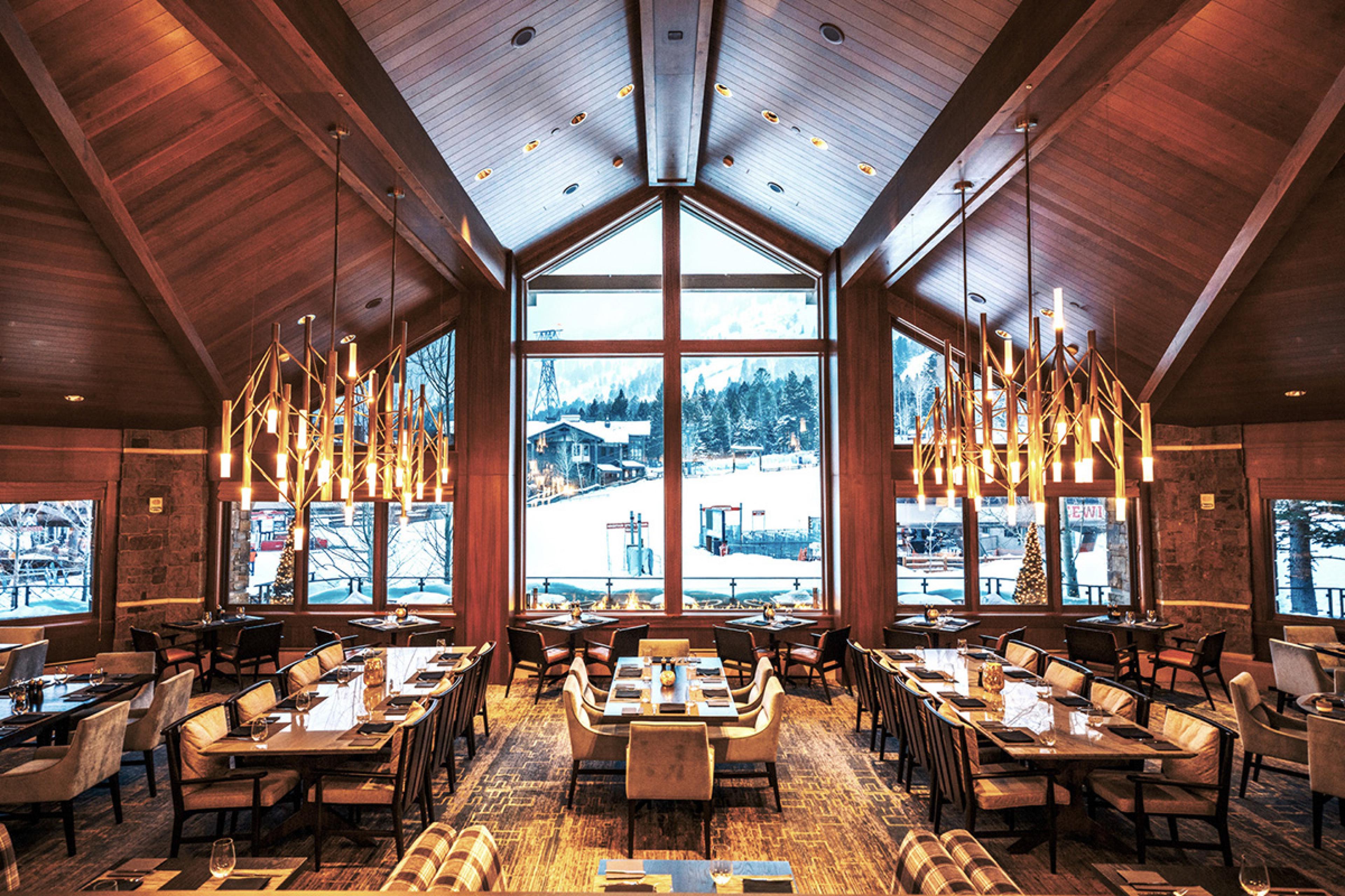 rustic, lodge style restaurant with large chandeliers
