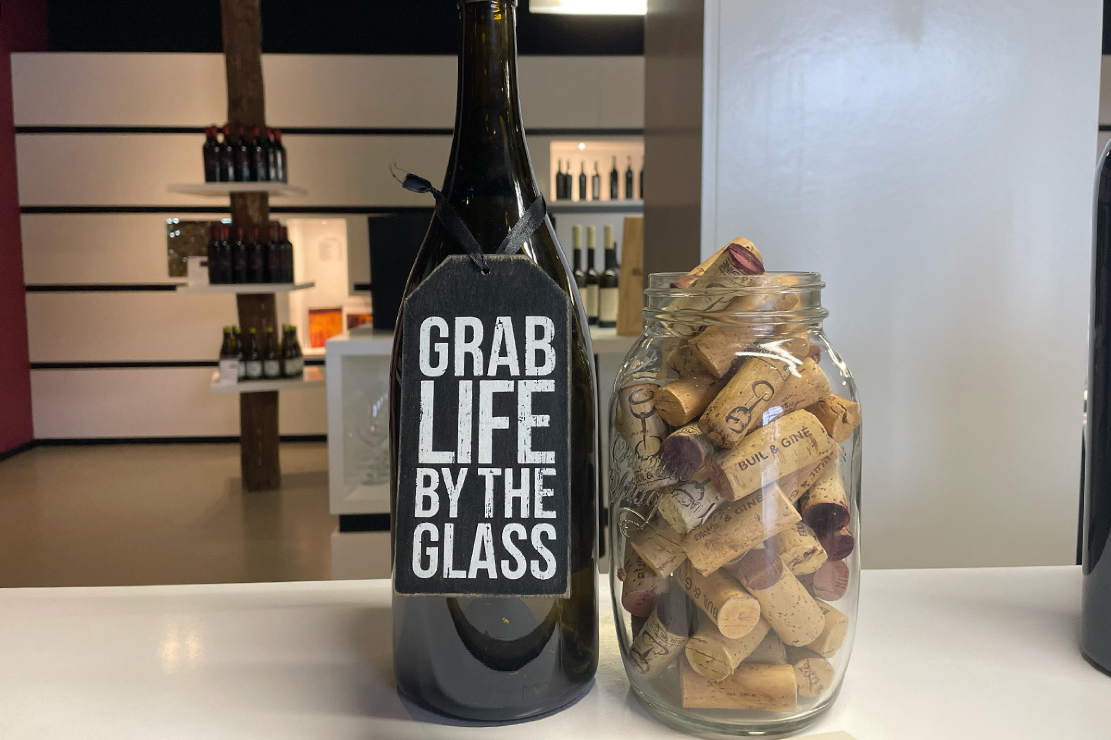 bottle of wine and jar of corks