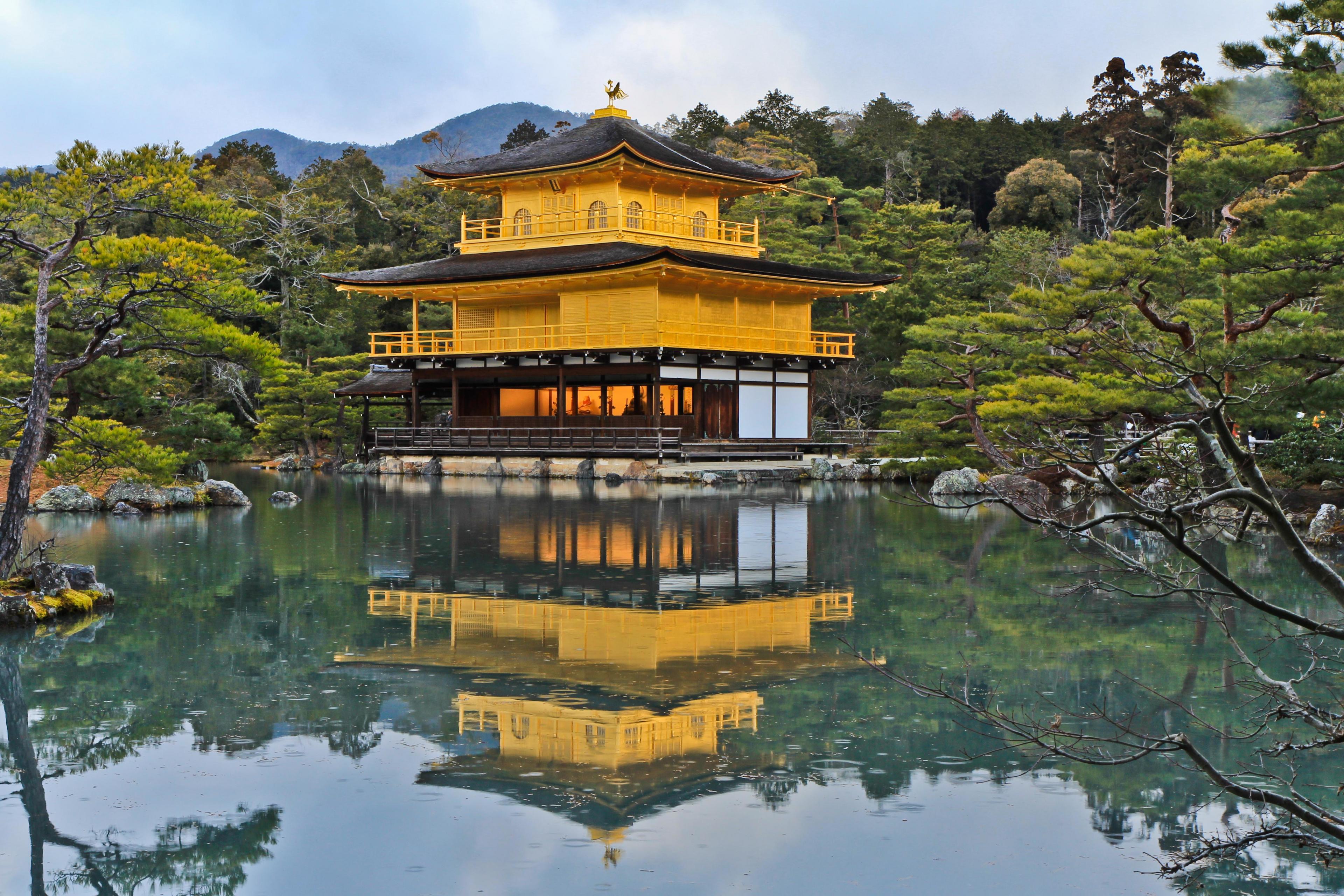 yellow pagoda on a pond