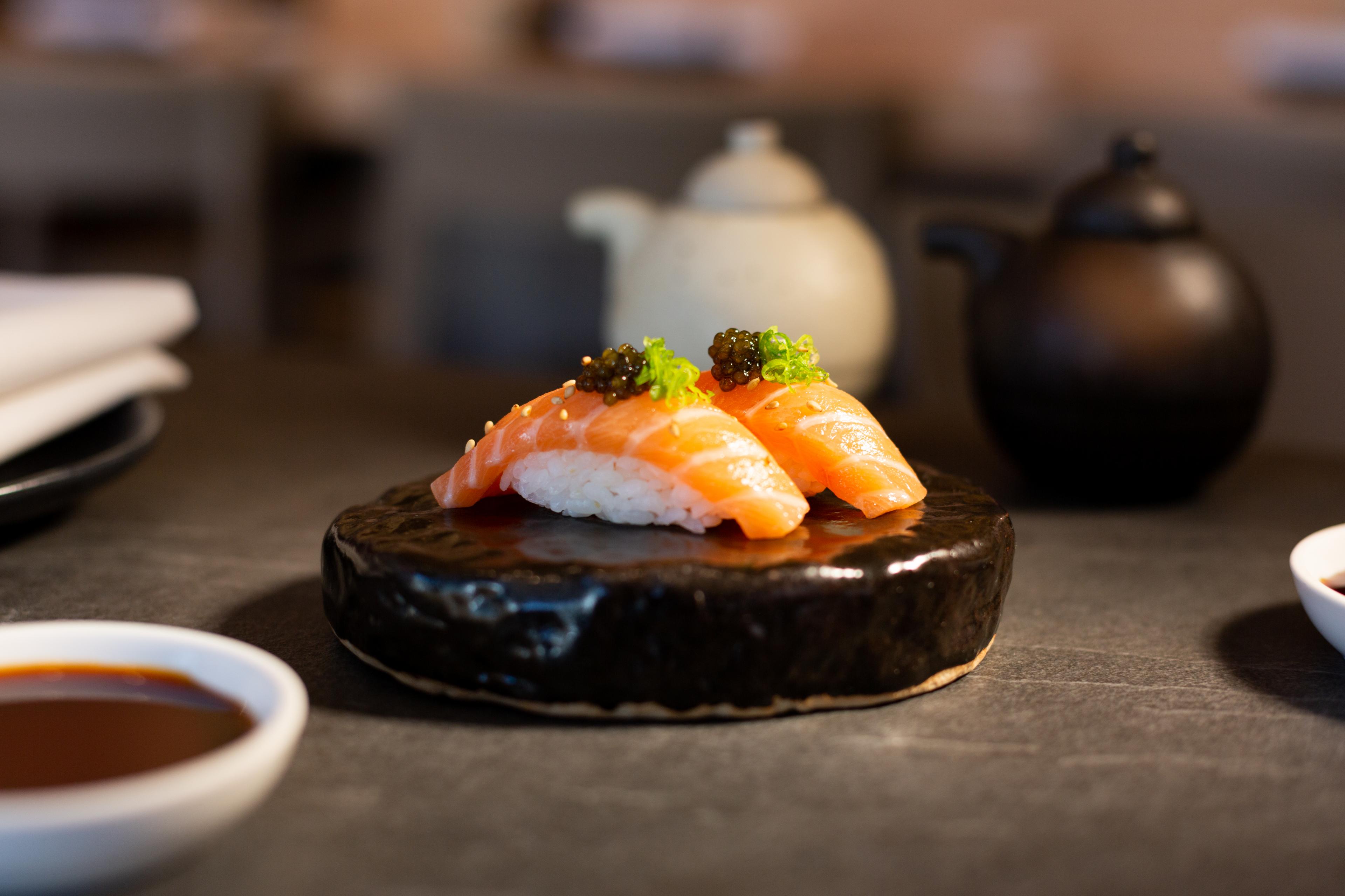 sashimi on a small round stone