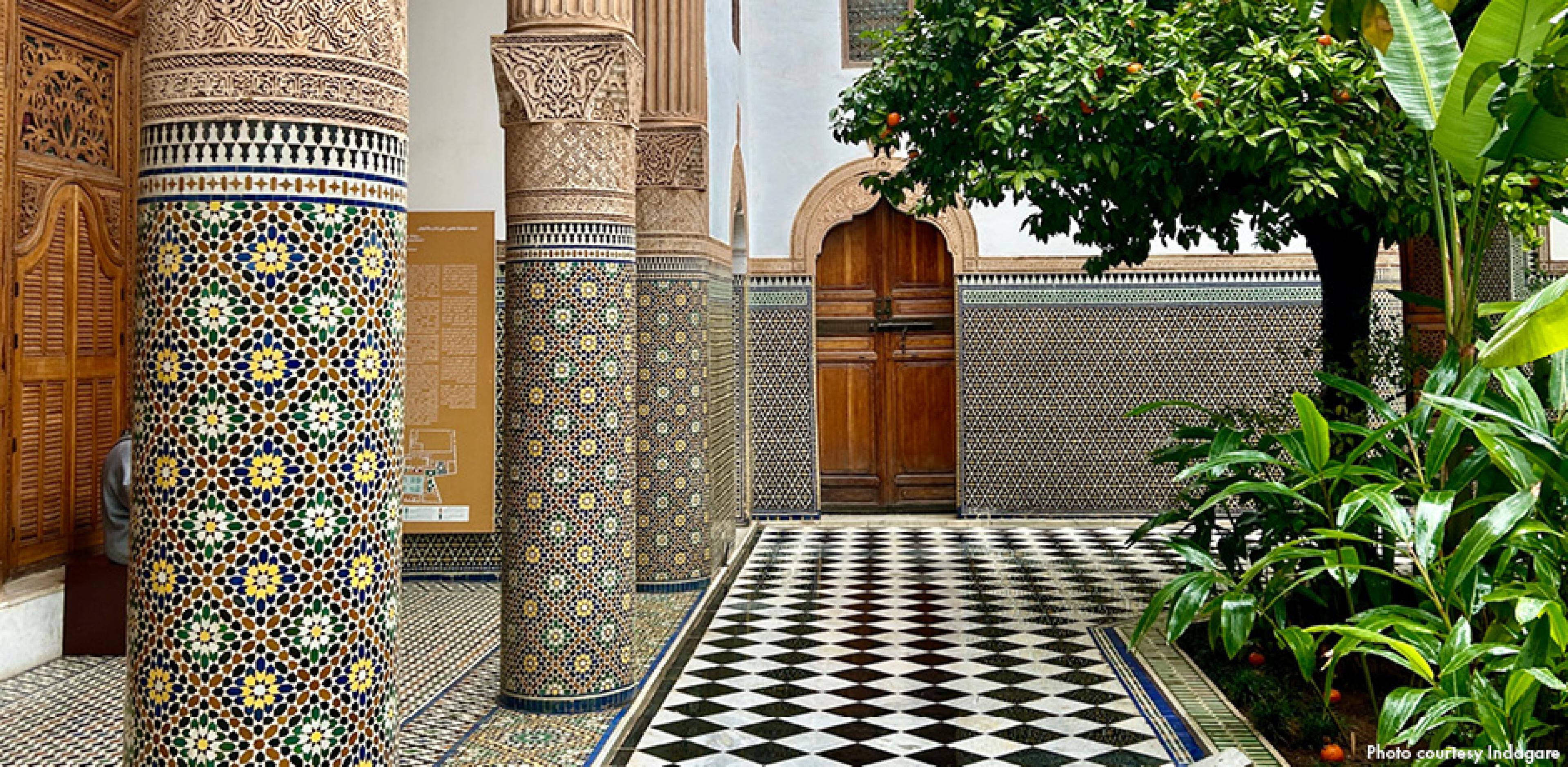 tiles in Marrakech, black and white on ground and colorful on pillars