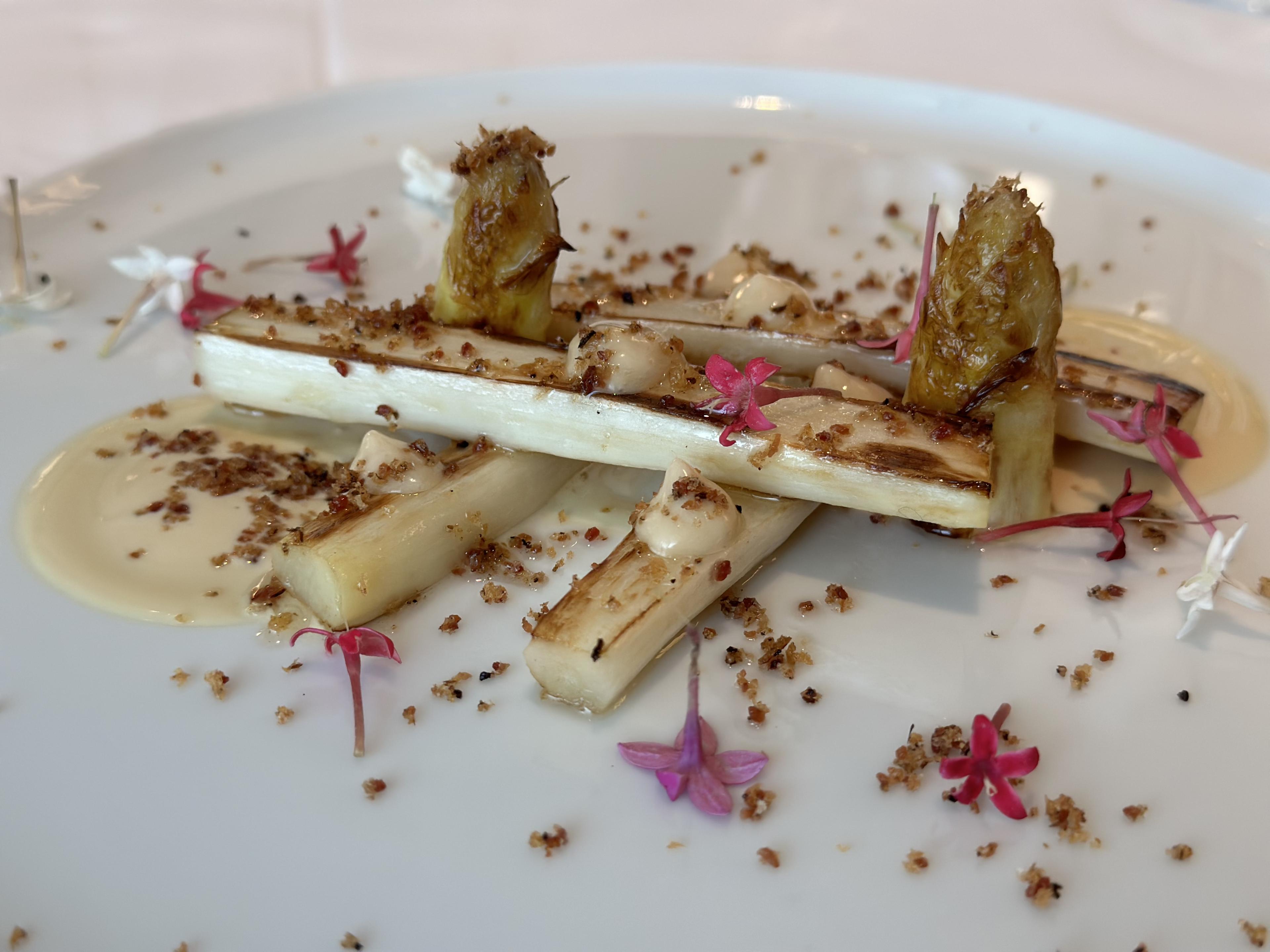 turnip with flower garnish on a white plate