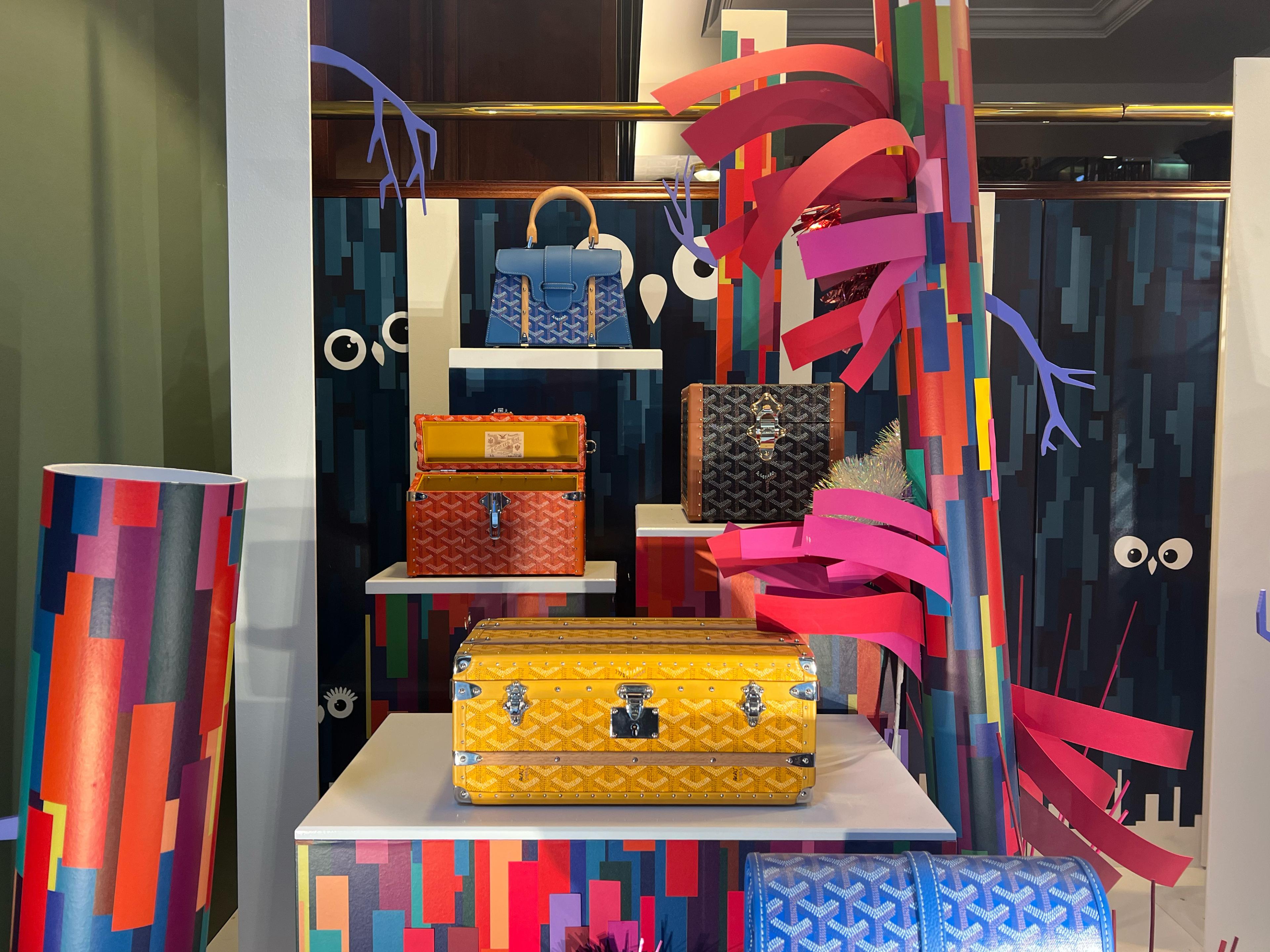 colorful designer bags on colorful shelves