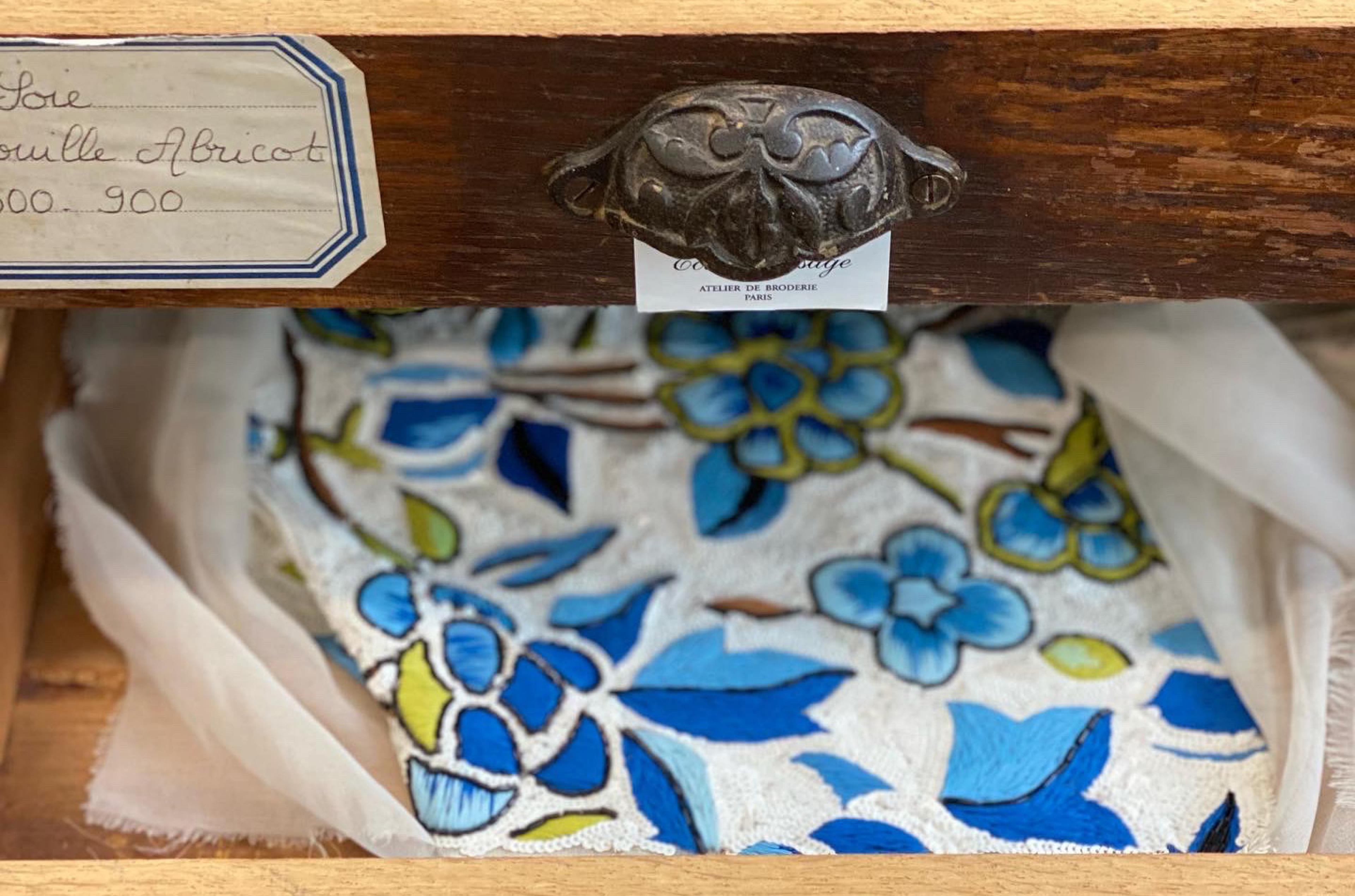 floral fabric in an ornate drawer