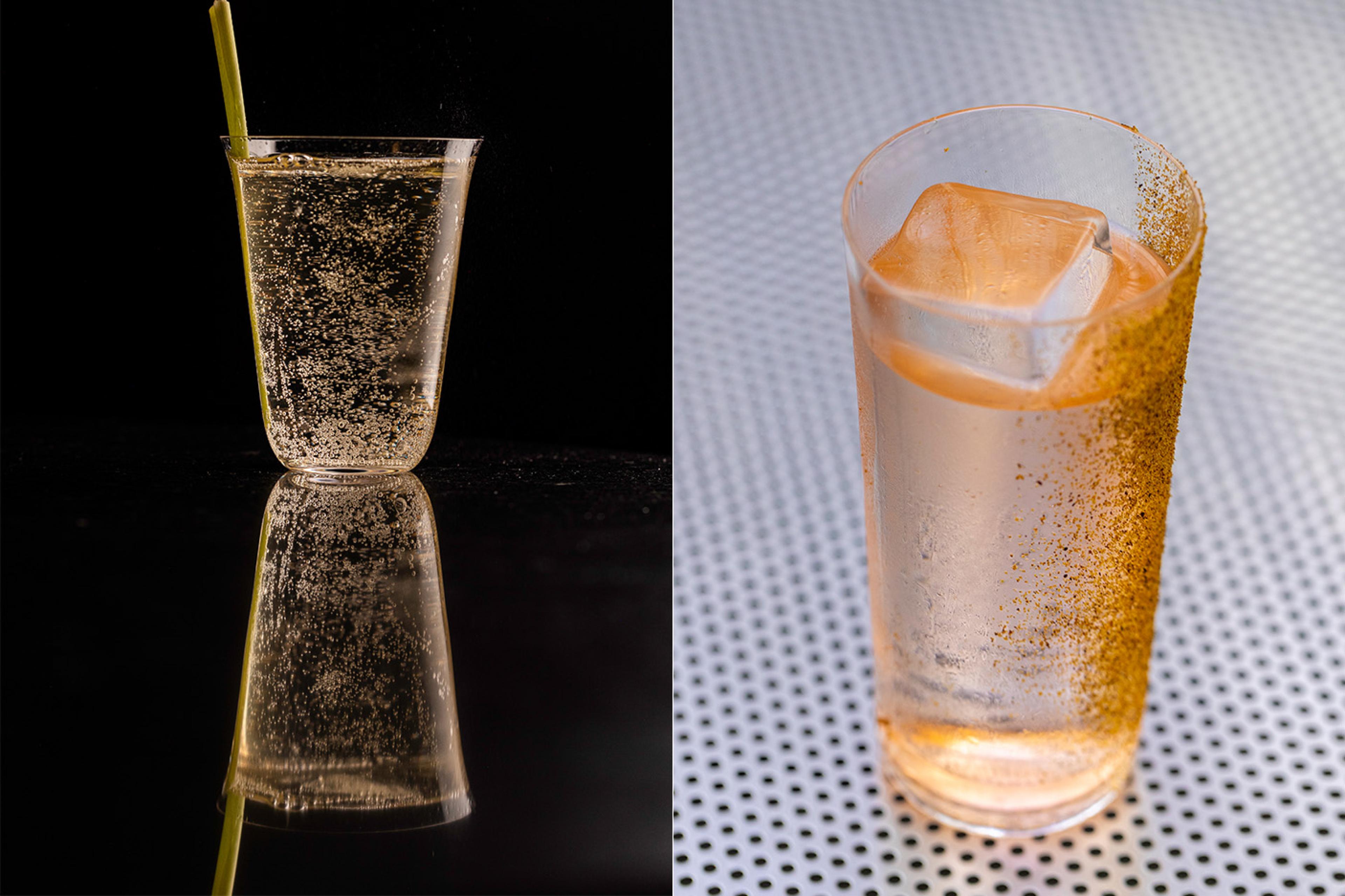 Fizzy cocktails with large ice cubes and spice garnish on one side of the glass 