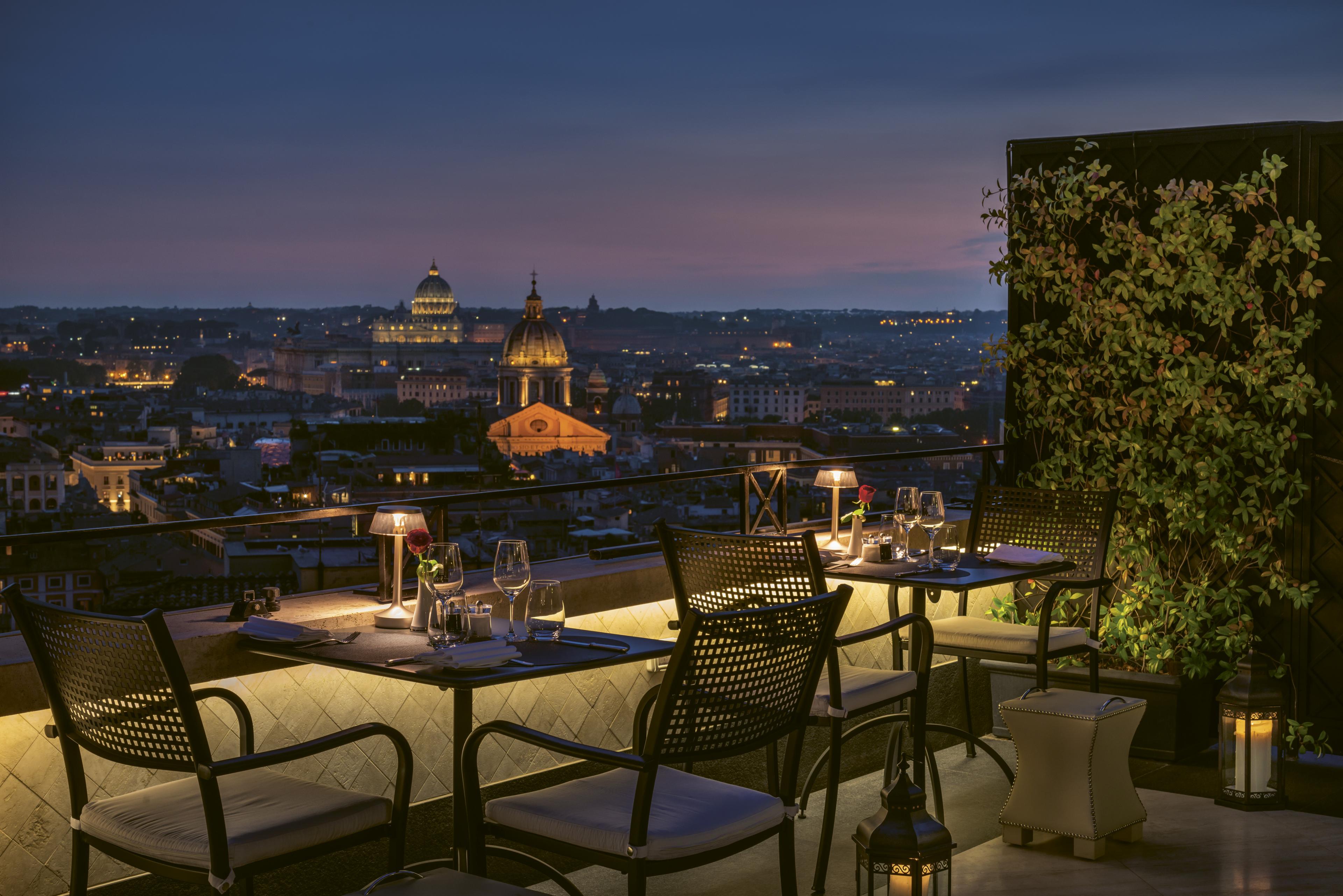 restaurant terrace view over rome at dusk