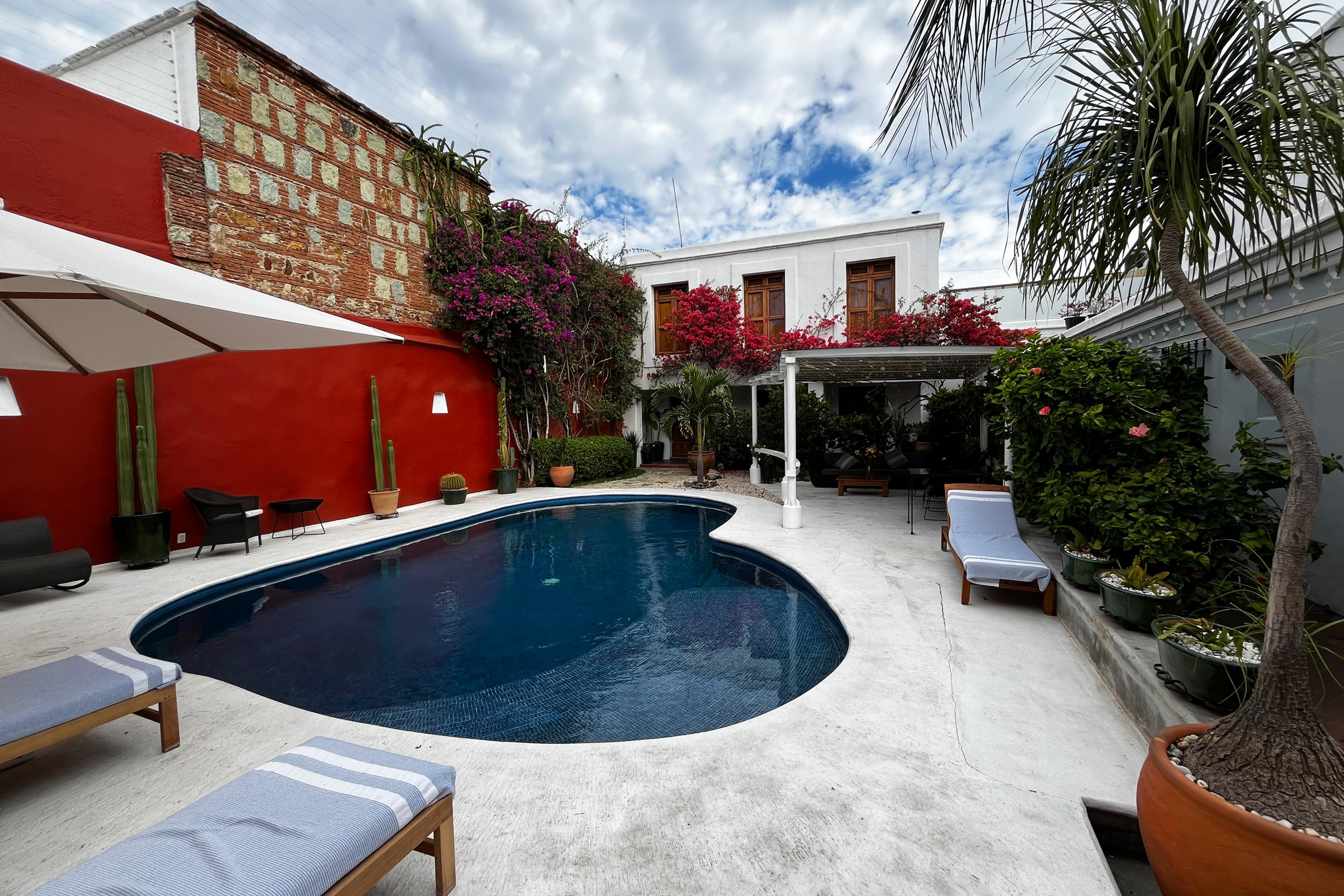 kidney pool in a patio behind a red building