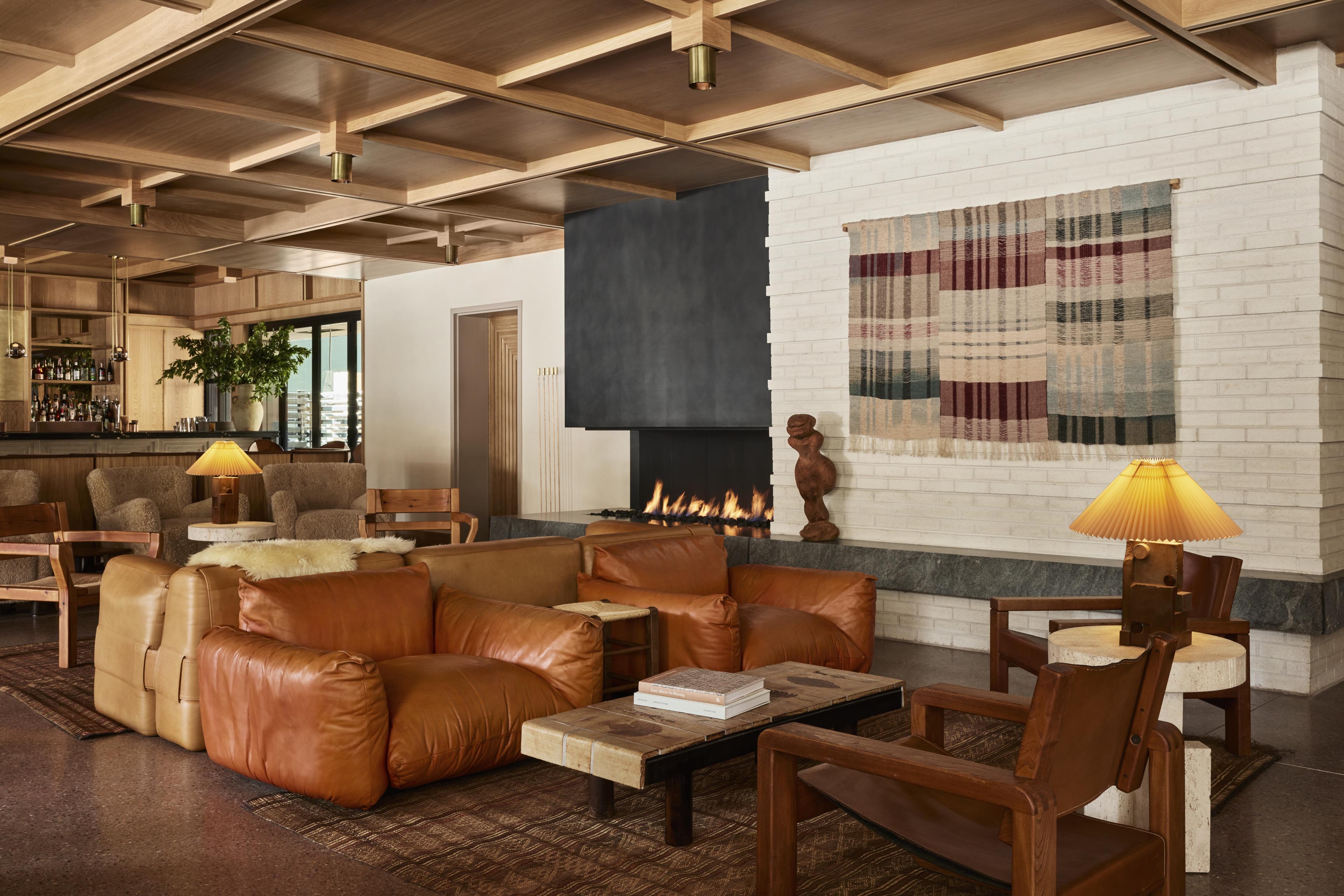lobby lounge with fireplace and neutral furniture