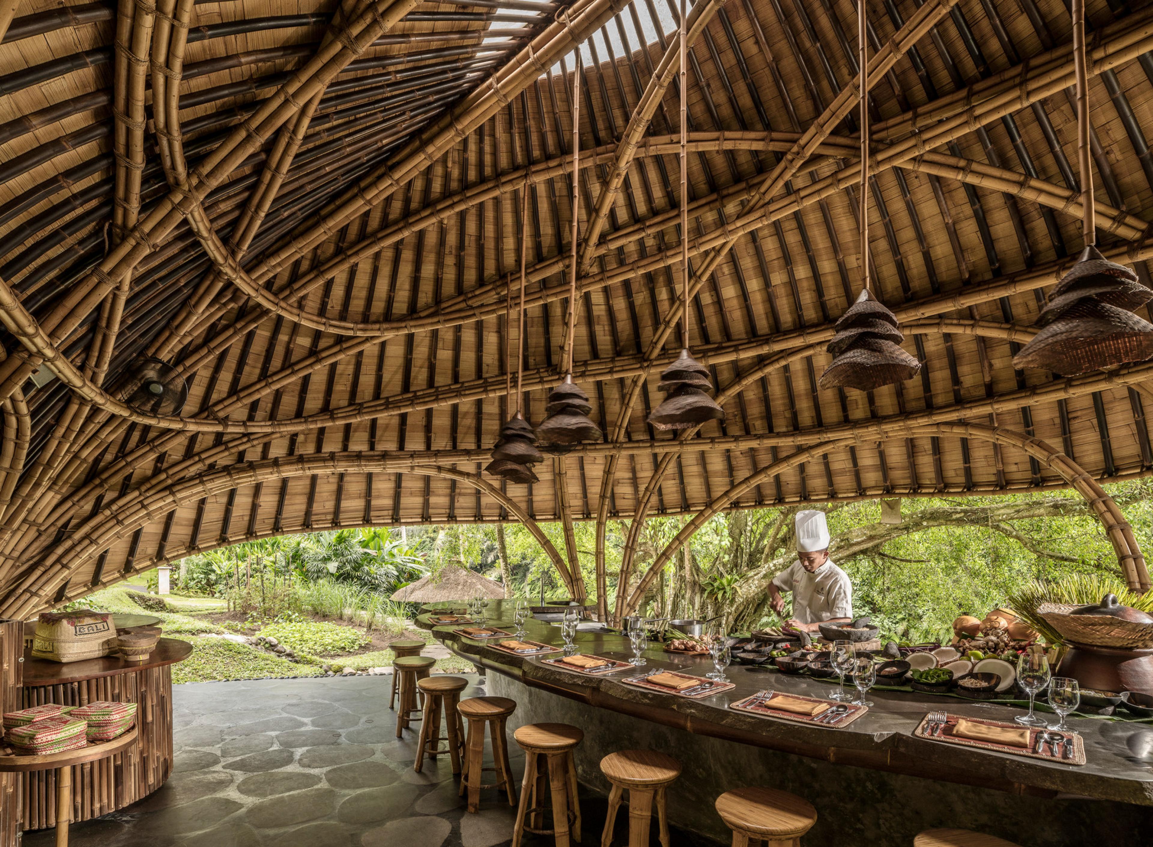 bamboo pavilion with a counter with a chef