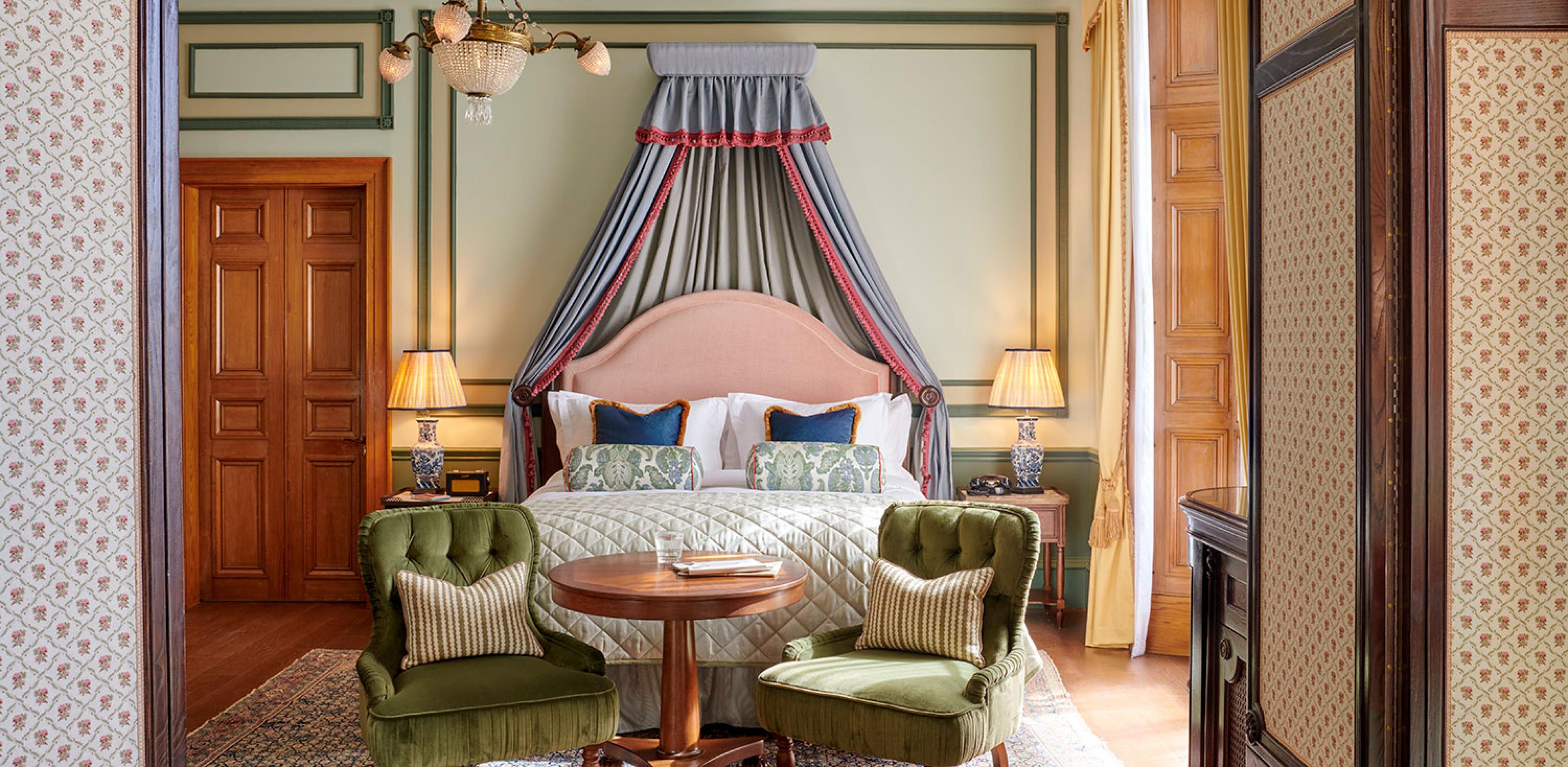 bedroom at luxury boutique hotel in scotland, with canopy bed and seating