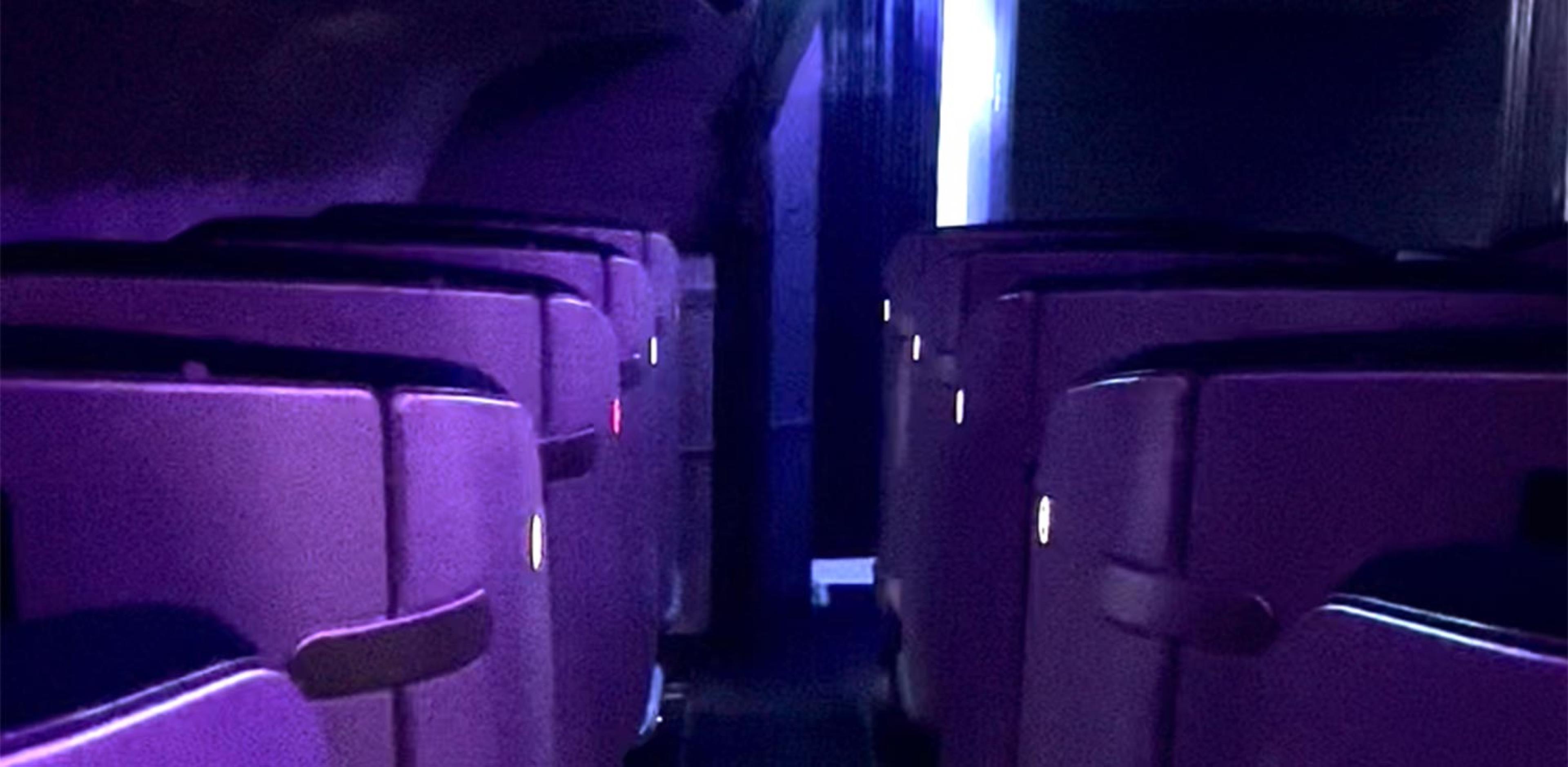view of business class seating at night on a plane