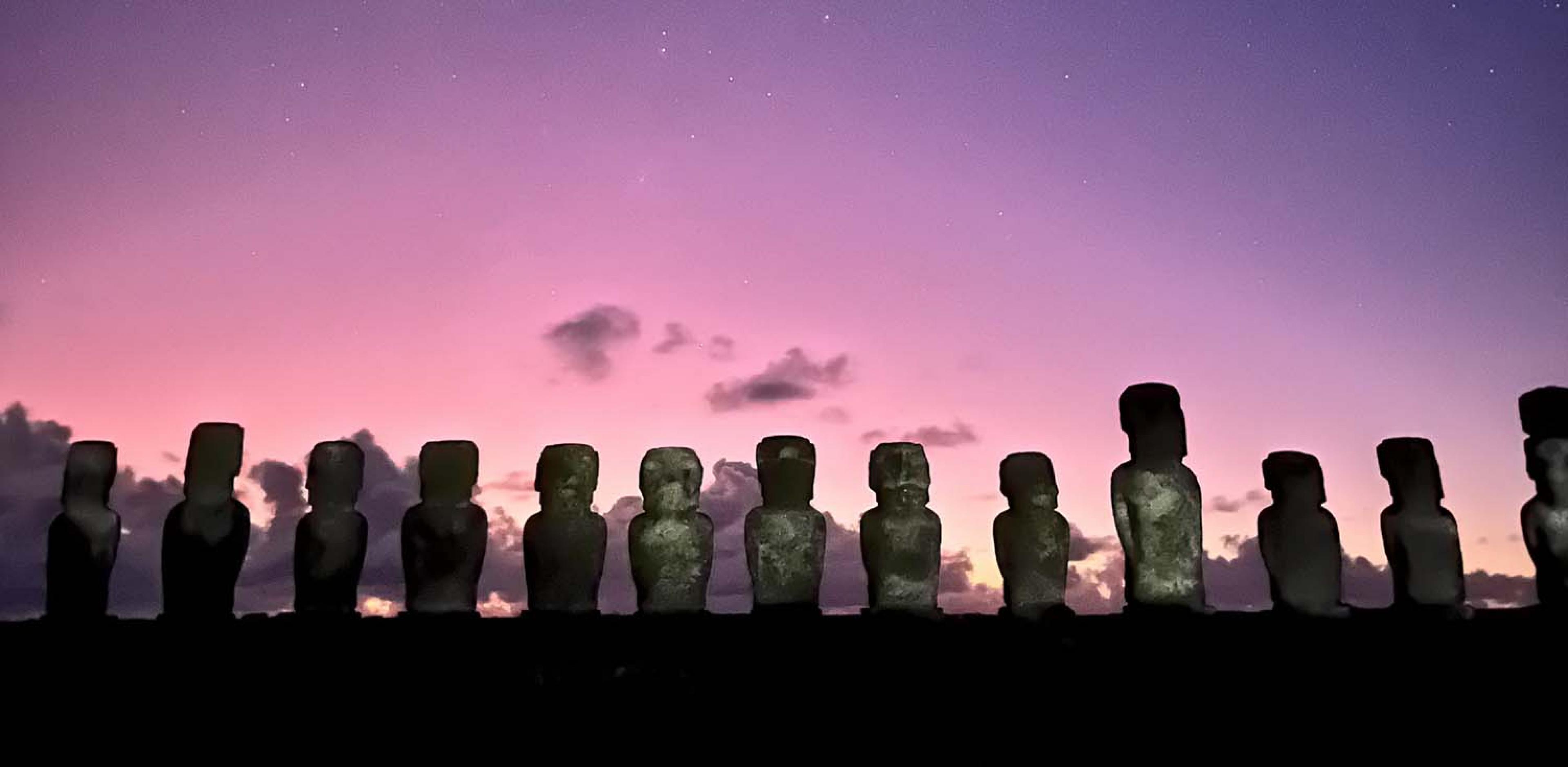 moai on a hill at sunrise