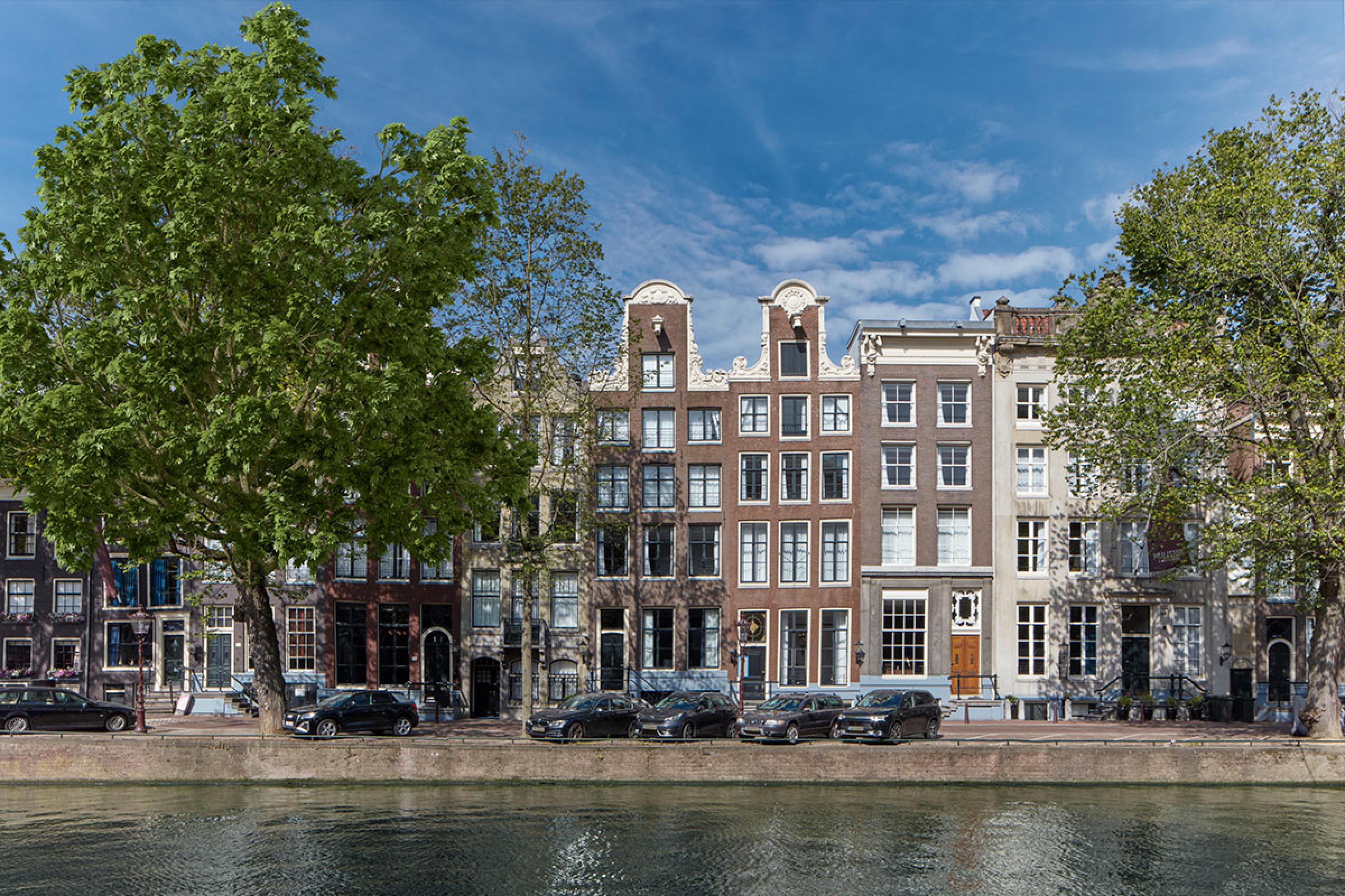 rowhouses in amsterdam along canal