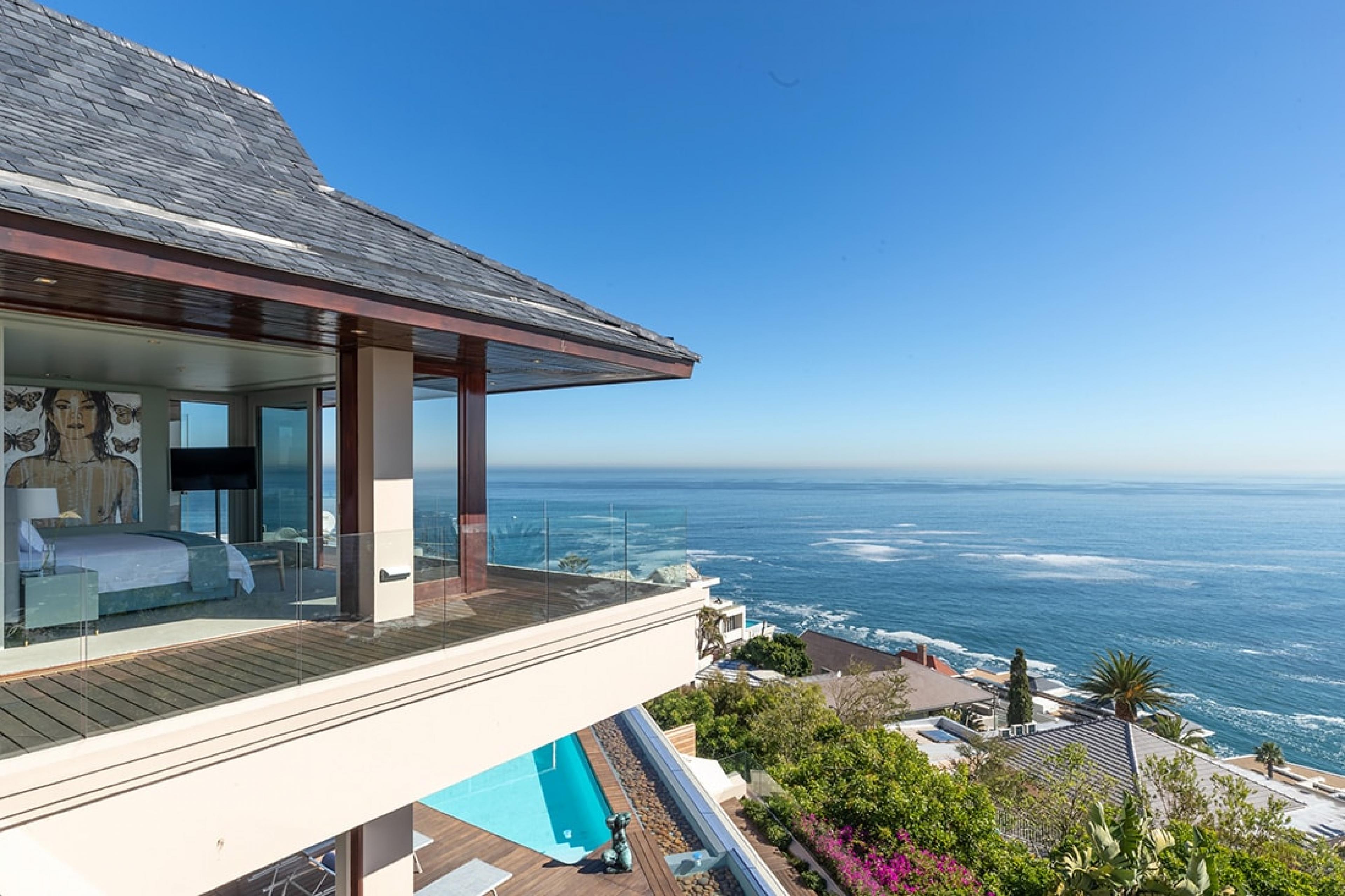 Ellerman House suite with terrace and modern art  looking over the ocean